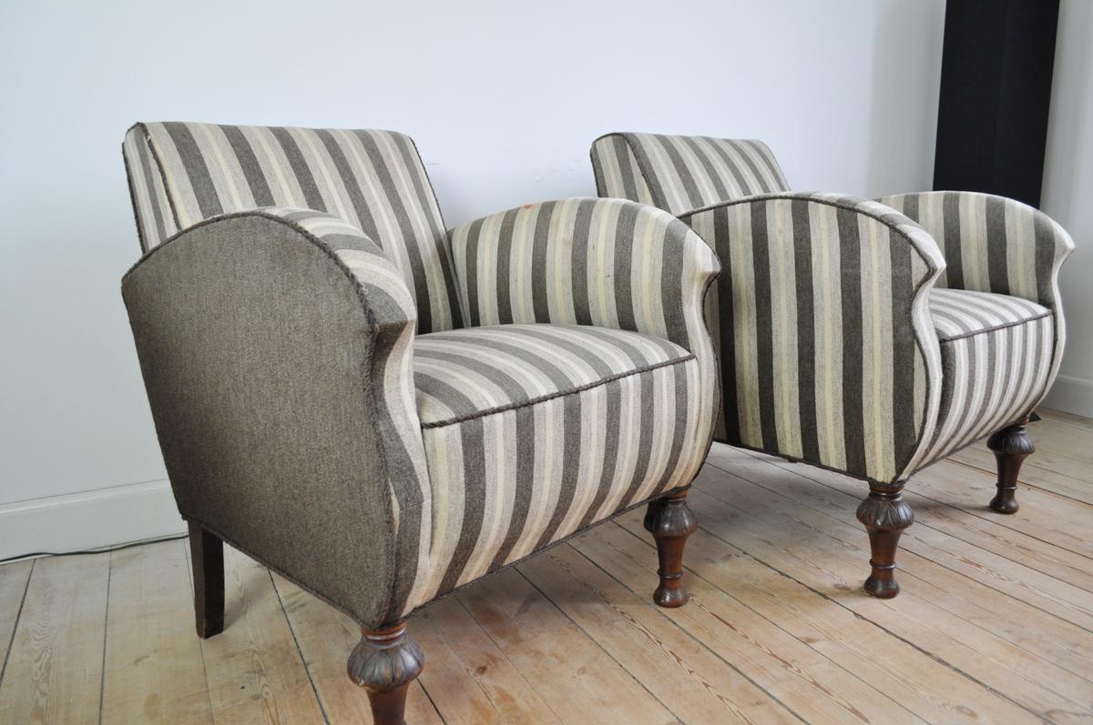 Set of 2 Danish Art Deco club or lounge chairs executed with wooden legs and wool fabric. Beautiful lines and curves with traits of Art Nouveau style.
Overall a good condition with signs of wear consistent with age and use.
We recommend new
