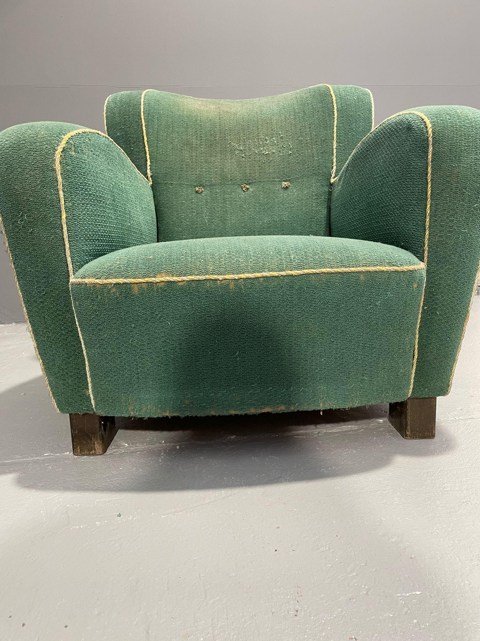 We offer a distinctive Danish club chair from the 1930s or 1940s, positioned between Art Deco and early Midcentury Modern design. The style reflects the Scandinavian 