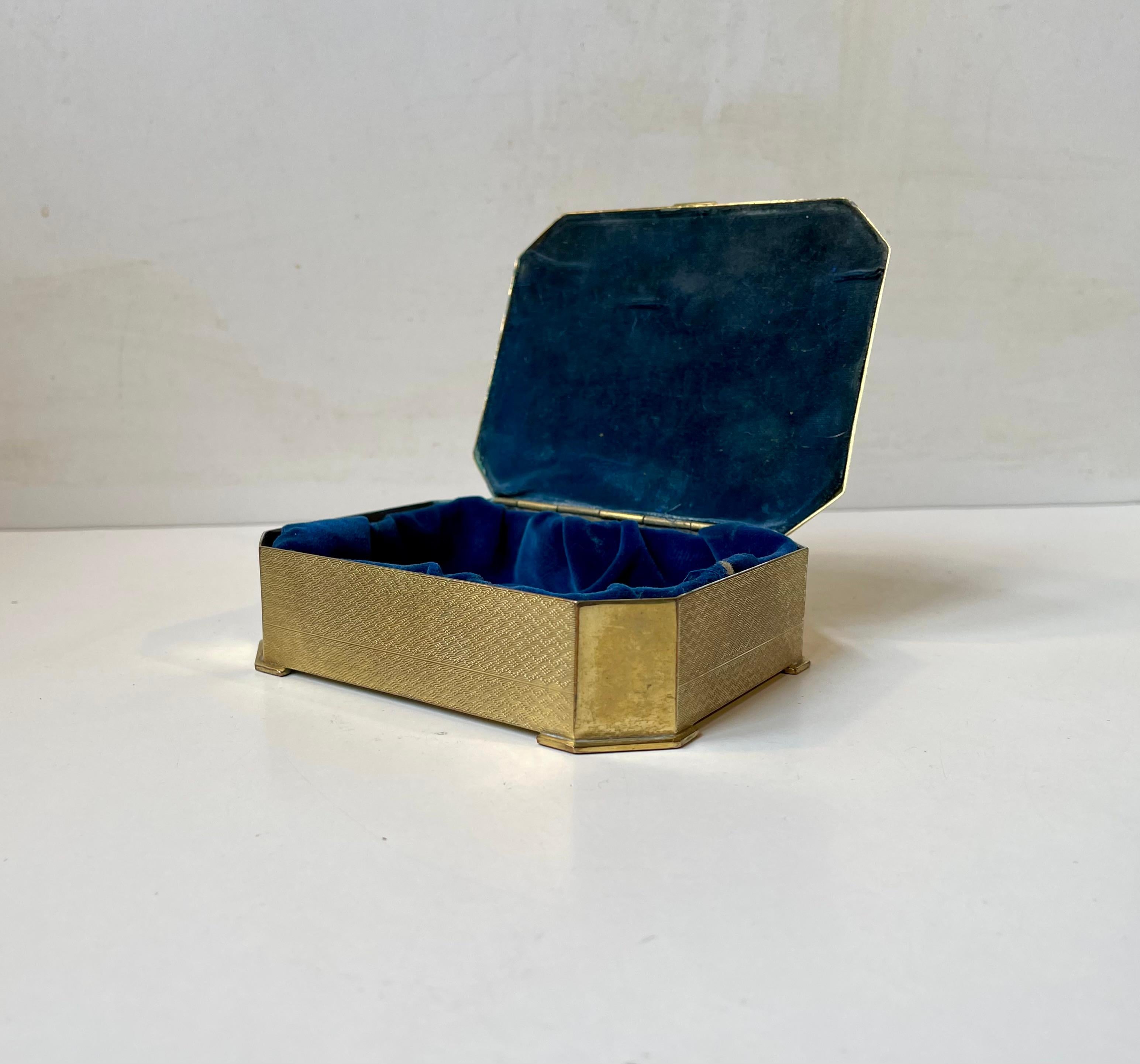 Ornate jewelry box, possibly converted from a cigar box in gilt bronze. Engine turned (Guilloche without enamel with gilt) and hand-engraved patterns throughout the piece. Made in Denmark during the 1920s or 30s. Engraved Guldbronze (Gilt bronze)