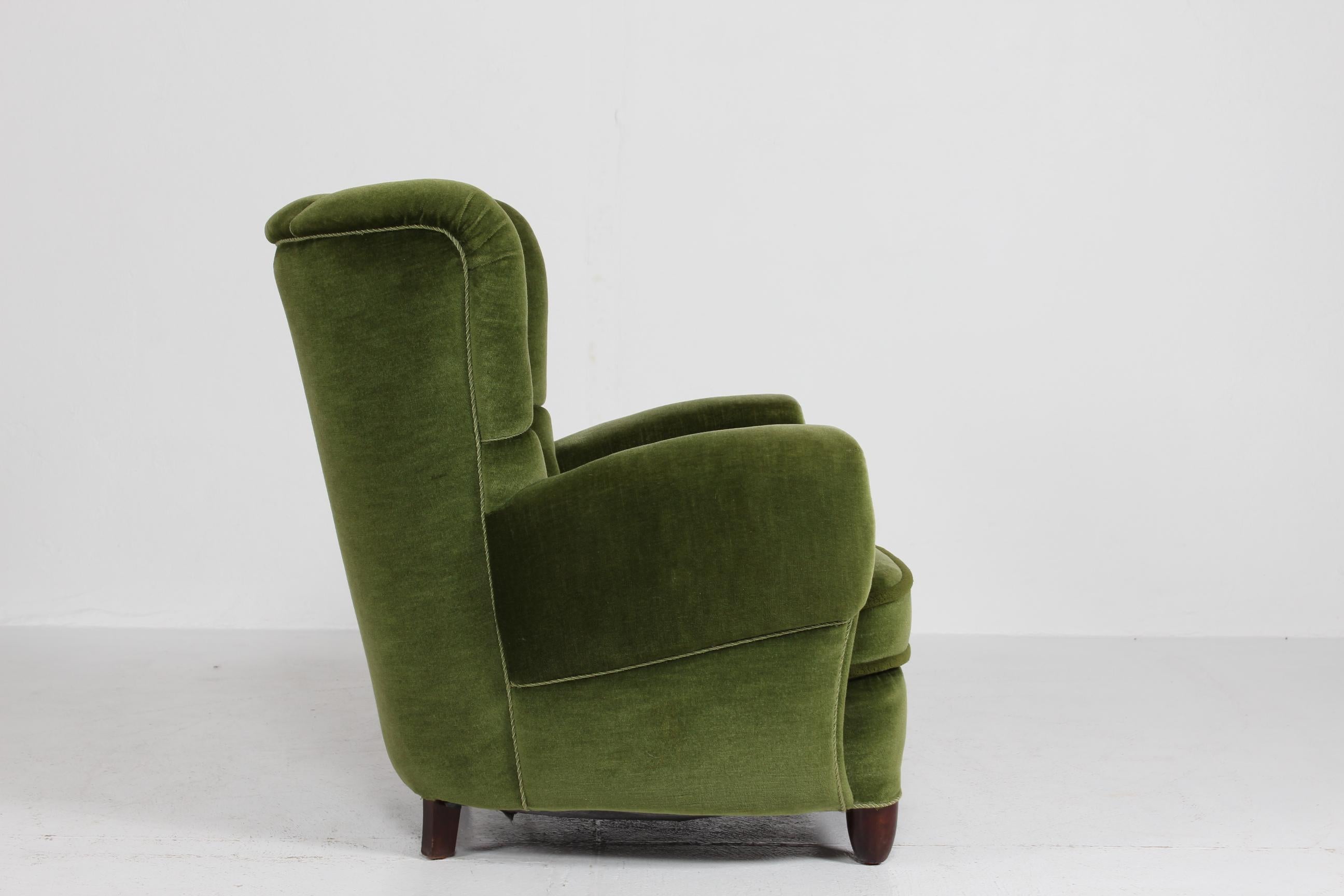 Mid-20th Century Danish Art Deco High Back Lounge Chair Upholstered with Dark Green Velvet, 1940s For Sale