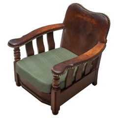 Antique Danish Art Deco Lounge Chair in Patinated Leather and Stained Ash