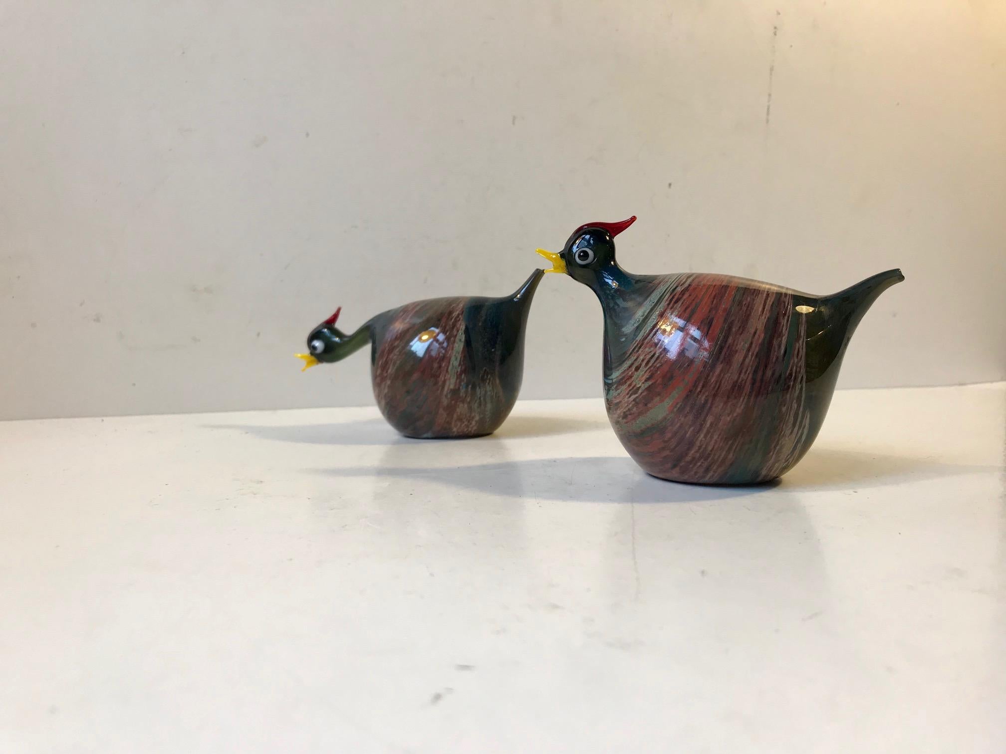 Decorative pair of hen figurines in marbled multicolored glass. Hand blown and finished by the founders of Danish glass art husband and wife John and Ulrika Poulsen.