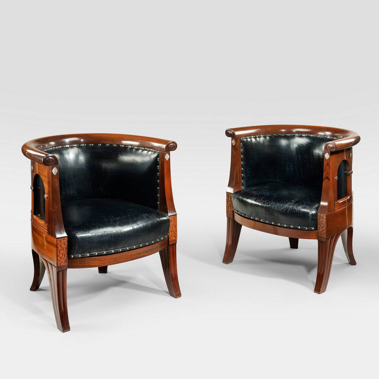 A pair of French Art Nouveau mahogany and mother of pearl Klismos chairs, upholstered in new distressed leather.

Made by Lysberg Hansen, now called Lysberg, Hansen and Thorp, are very high quality furniture makers in Central Copenhagen. The