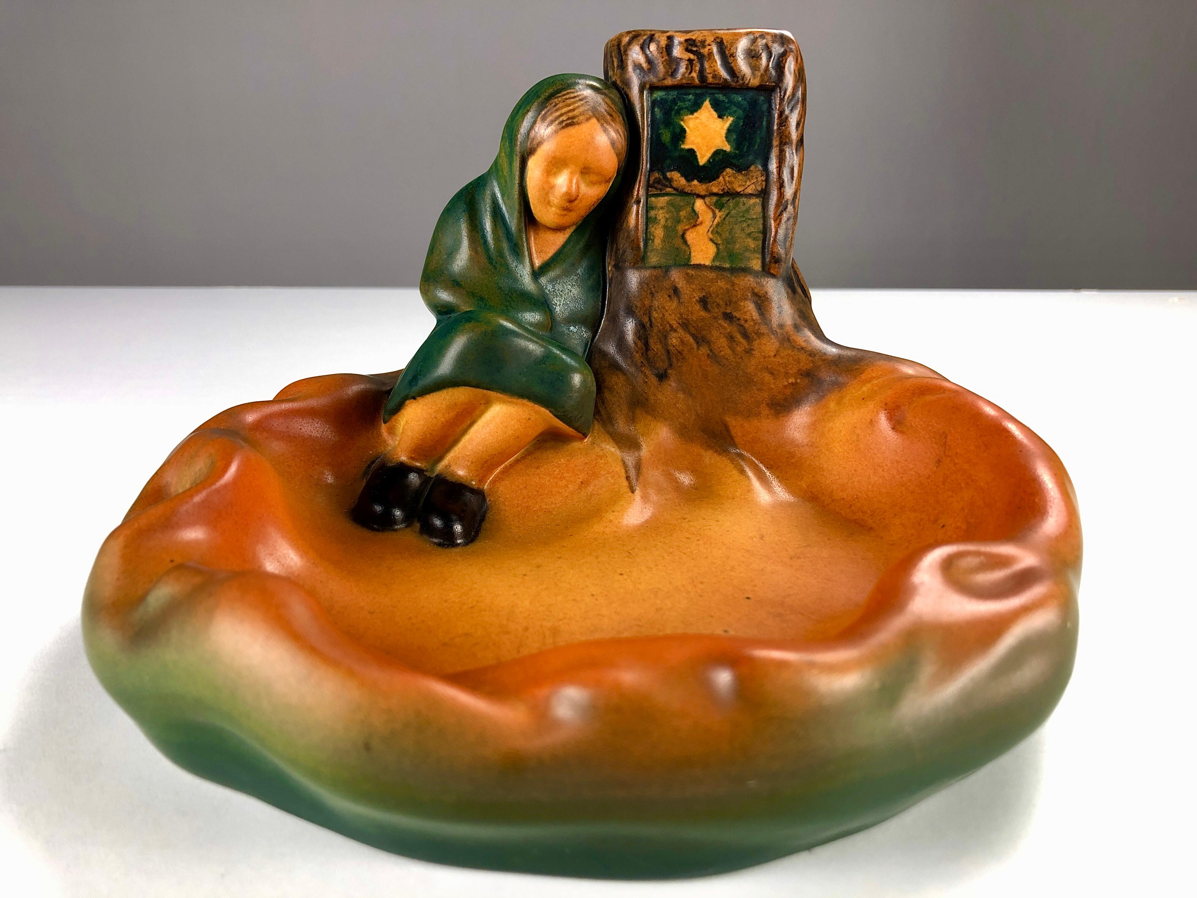 Danish Art Nouveau match holder and ash tray by Viggo N. Myhregaard for P. Ipsens Enke in 1924

The handcrafted art nuveau match holder and ash tray was inspired by H.C. Andersens farytale 
