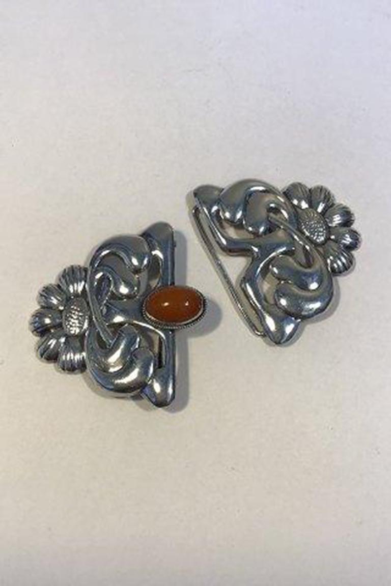 Danish Art Nouveau Silver Belt Buckle with Amber.

Measures 9.5 cm x 6.2 cm (3 47/64 in x 2 7/16 in) Weight 30.6 gr/1.08 oz.