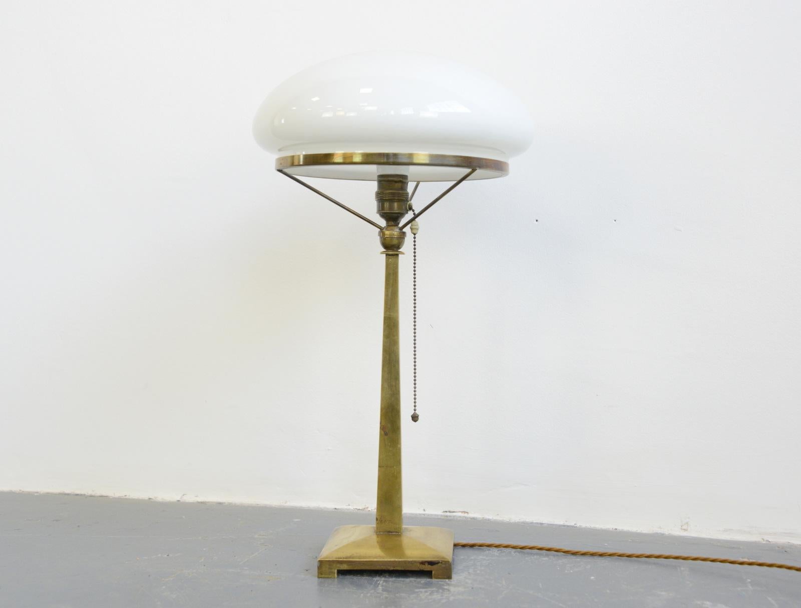 Danish Art Nouveau table lamp, circa 1910

- Opaline glass shade
- Brass base
- Original bulb holder and pull cord
- Takes E27 fitting bulbs
- Danish, 1910
- Measures: 58 cm tall x 30 cm wide x 30 cm deep

Condition report:

Re wired with