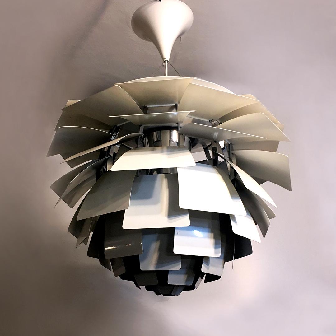 Danish Artichoke chandelier by Poul Henningsen for Louis Poulsen, 1958
Steel Artichoke chandelier is one of the design classics. The piece consists of 72 leaves in matte white stainless steel, distributed in 12 rows and thanks to its particular
