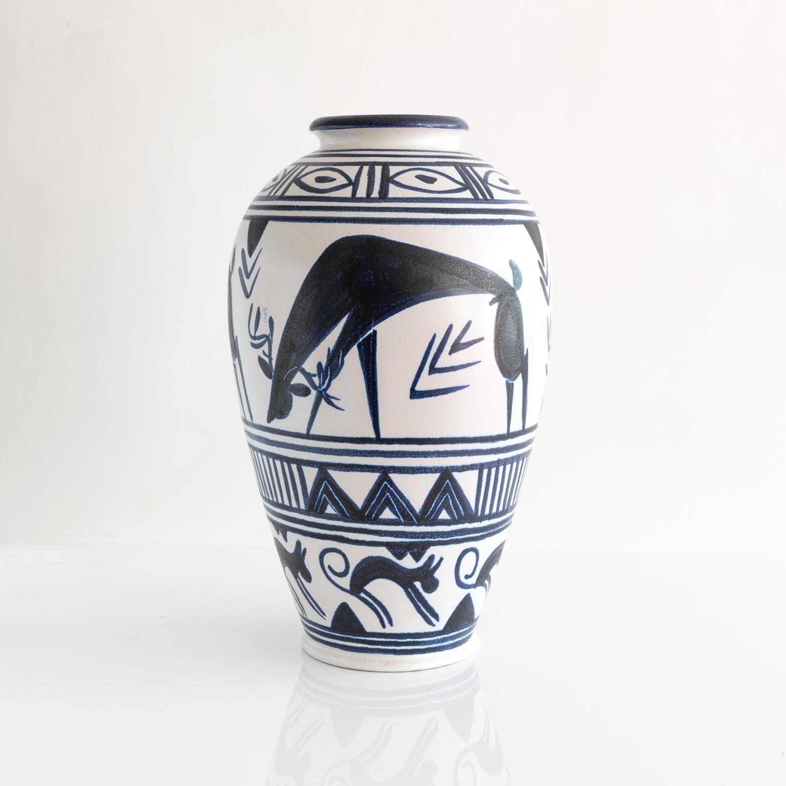 A large-scale, hand decorated vase by Danish artist Mette Doller for the Swedish company Andersson & Johansson - Höganäs Ceramic, circa 1950s. The vase depicts grazing deer and geometric patterns. Vases are not drilled but could be converted to