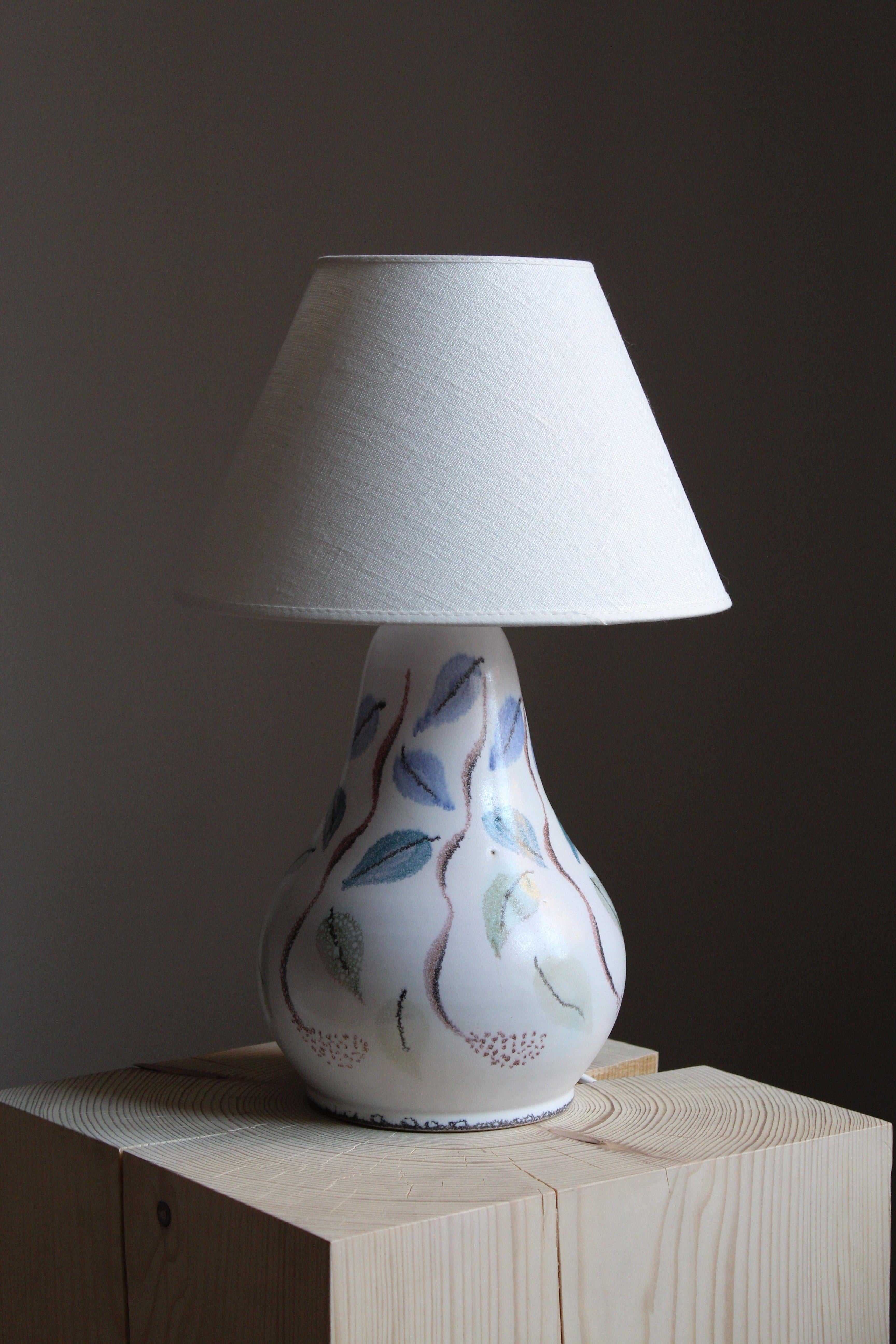 An organic table lamp. Produced by an unknown Danish artist. Signed unintelligible, stamped 