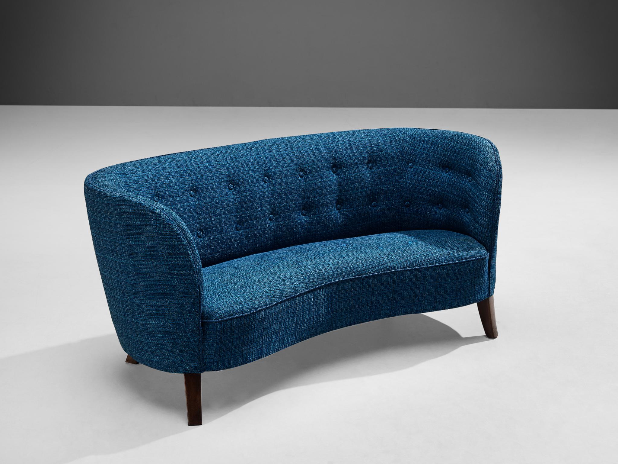 Banana sofa, fabric and oak, Denmark, 1960s.

This two seat sofa is executed in a bright blue fabric with wooden legs. The sofa has a high and curved backrest. The back gracefully flows into the armrests, creating a slightly curved shape. The piece