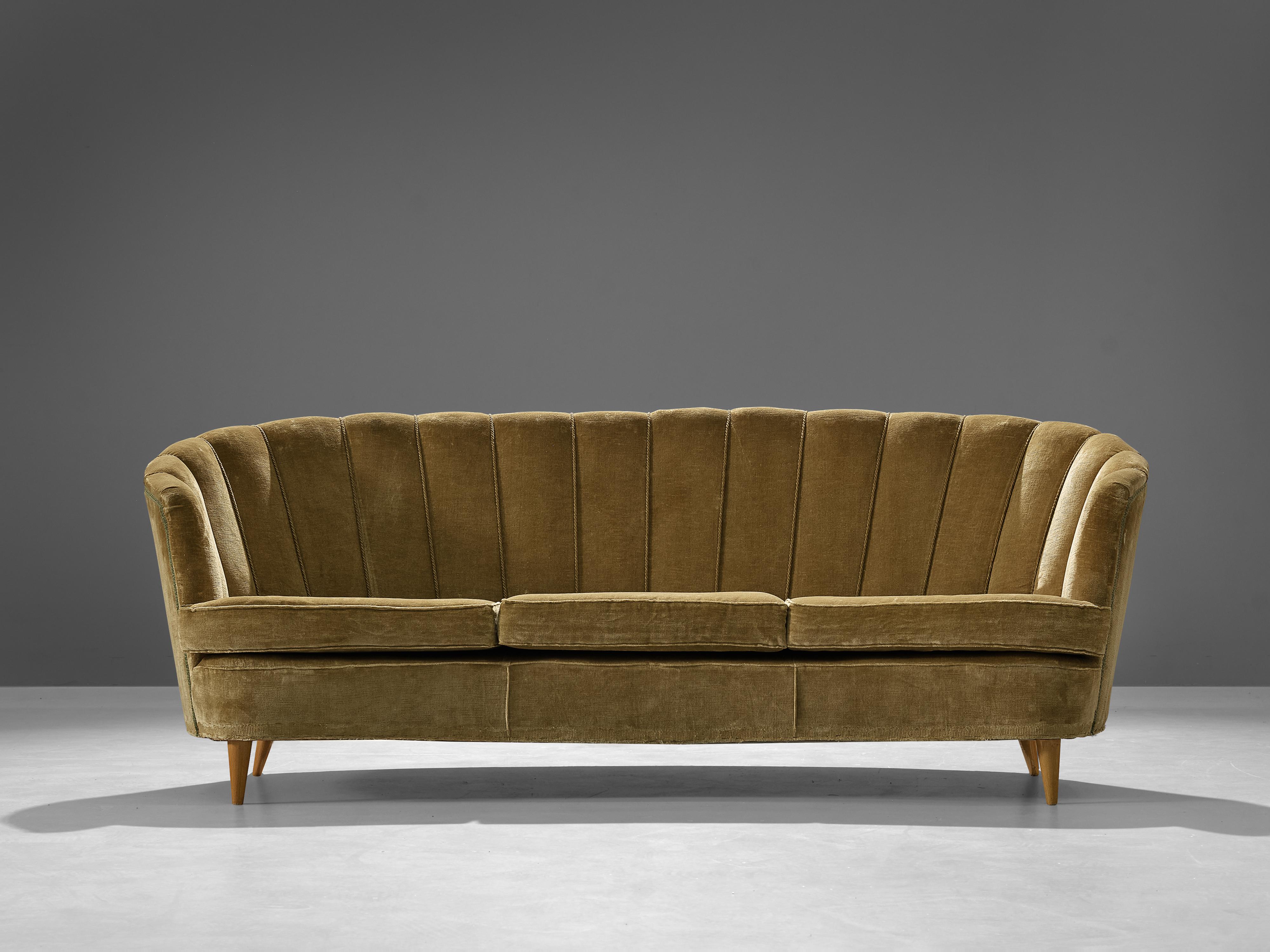 Banana sofa, upholstery, wood, Denmark, 1940s.

This voluptuous sofa is executed in a golden coloured velvet with wooden legs. The sofa has a high lined and curved back. The backrest is curved and flows over into armrests. The defined lines that