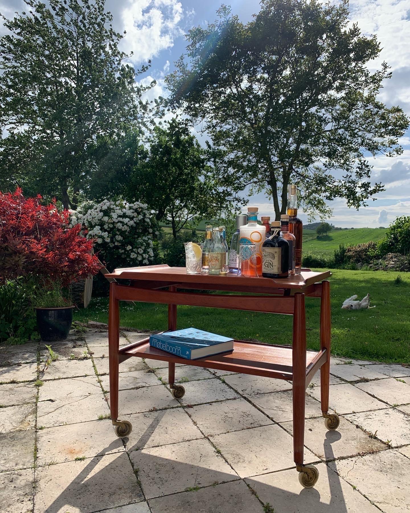 Every home should have a nice bar table or ditto bar cart. Just look at this beauty. Very lovely bar cart in teak made by a Danish master carpenter in the late 50s. Beautiful details with curved shelf and top. The top serves as a tray and is