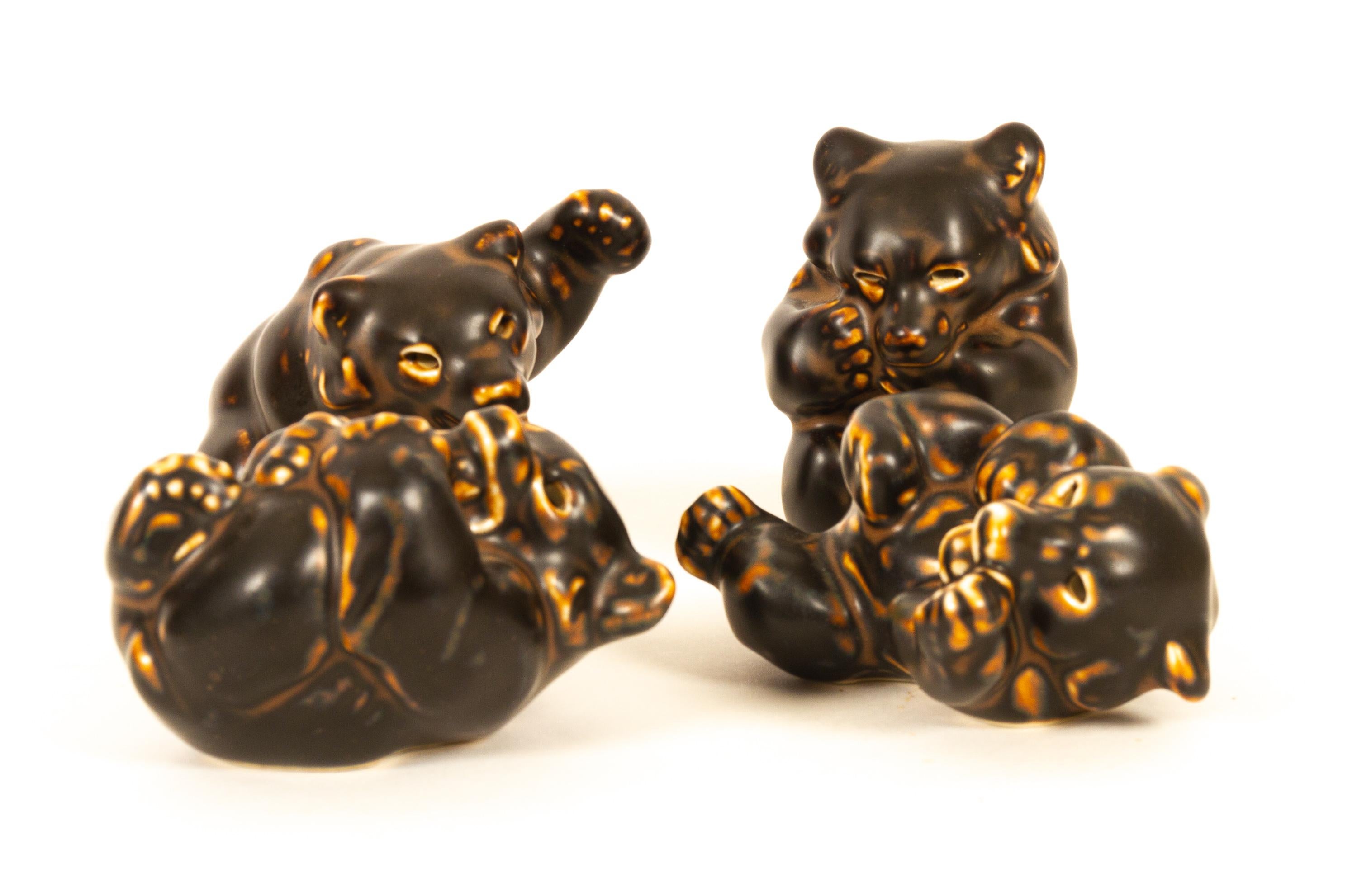 Danish bear cubs figurines by Knud Kyhn for Royal Copenhagen 1950s Set of 4.

Ceramic figurines designed by Danish ceramist Knud Kyhn, Models no: 21432, 21433, 21434 and 21435.

Perfect condition, 1. factory quality. No chips or cracks.