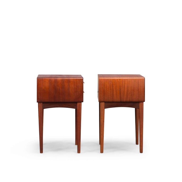 Set of Danish design teak bedside tables designed by Johannes Andersen for Silkeborg Møbelfabrik, 1960. A pair like these rare bedside tables are highly sought after these days. Each cabinet has two drawers with a nice handle.

The bedside tables