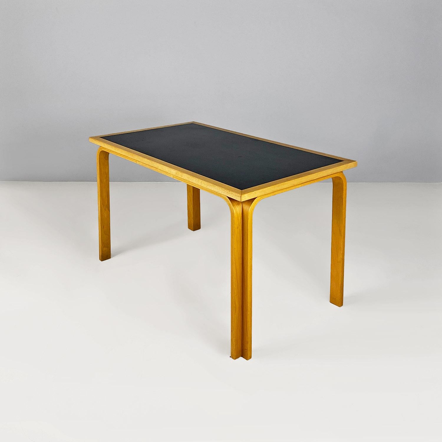 Danish beechwood dining table by Thygesen and Sorensen for Magnus Olesen, 1970s.
Danish dining table model DK 7870, rectangular in shape, with curved solid wood legs and black linoeum top.
Designed by Magnus Olesen in approx. 1960, production label