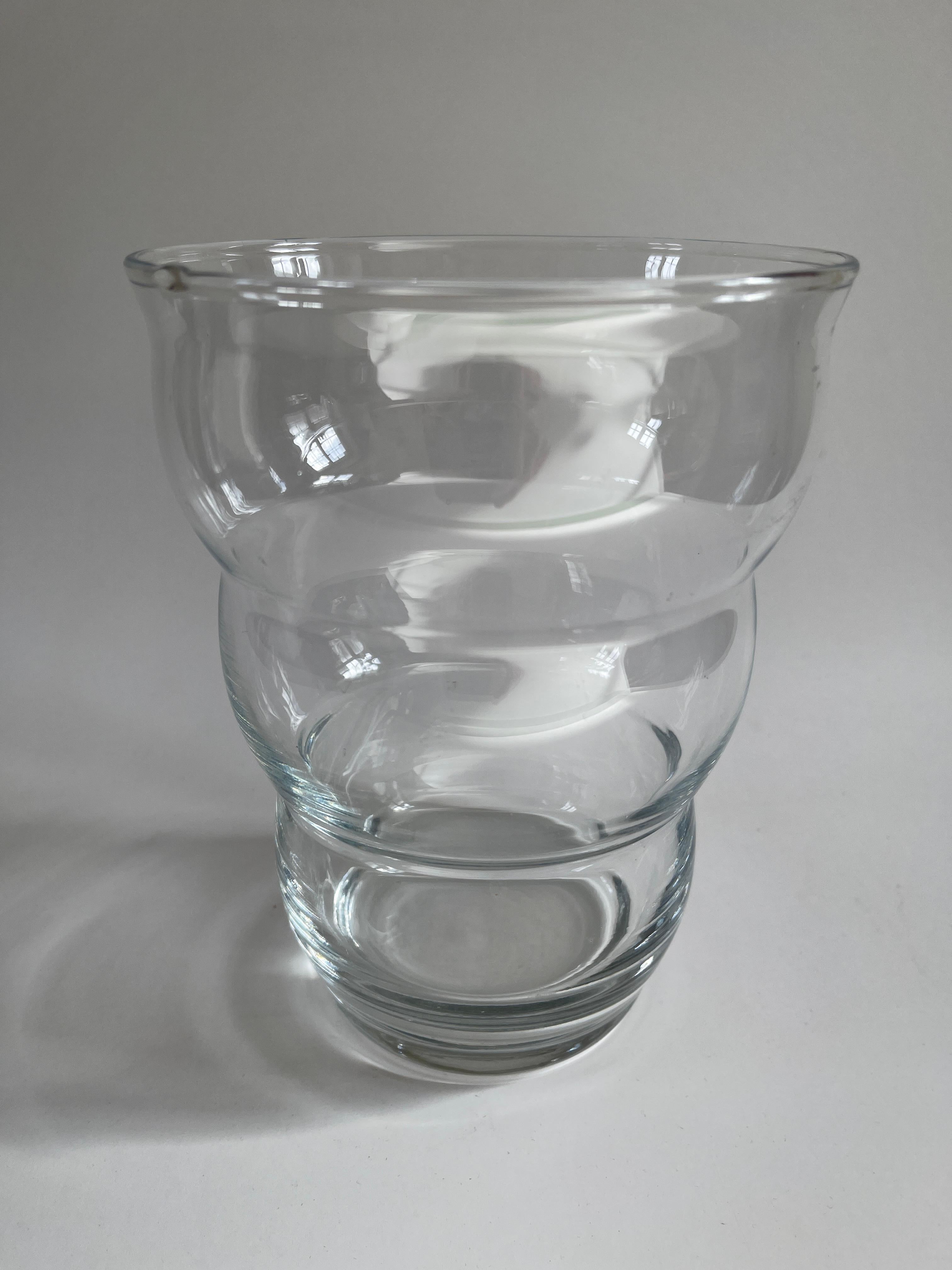 Lustrous clear glass beehive form vase with sensuous light capturing curves.
Denmark, c. 1960's.