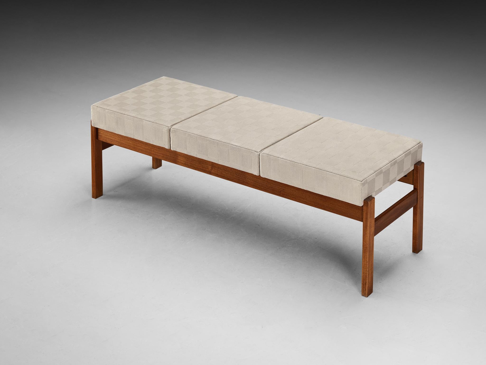 Bench, teak, fabric, Denmark, 1950s

A Scandinavian Modern furniture piece exuding a sense of harmony and purity. The bench, with its rectangular shape, showcases an upholstered seat in a checkered patterned fabric in a crème color. Crafted from