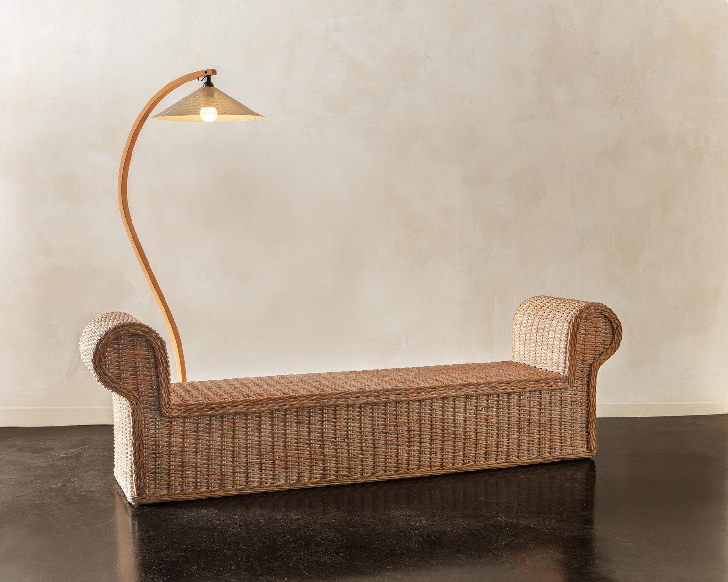 A Danish bentwood floor lamp designed in the 1970s for Caprani of Denmark. Featuring a unique perforated metal shade; a C-shaped metal base, a gorgeous bentwood wooden frame and a floor switch.
