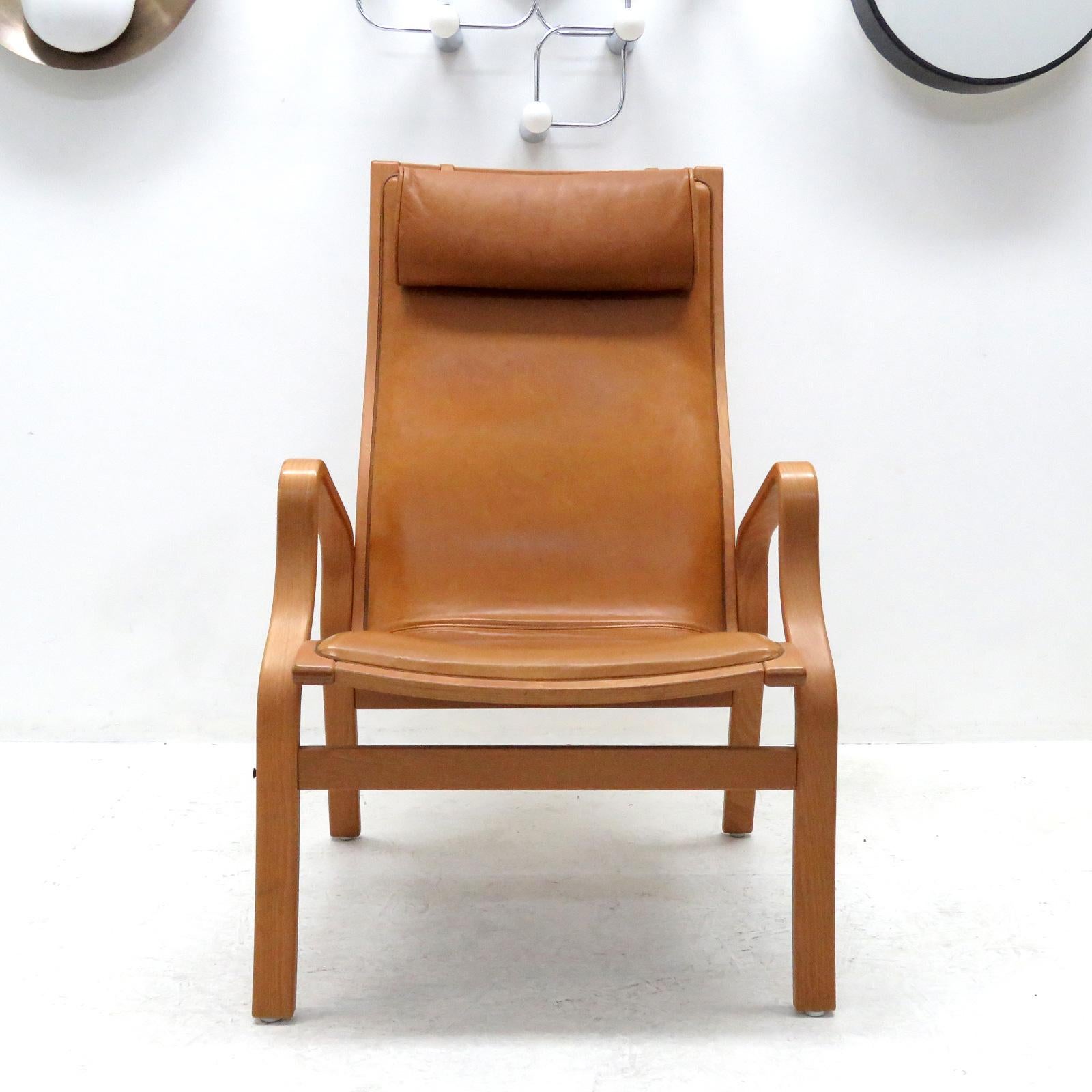 Striking 1950s Danish bentwood chairs, similar to Bruno Mathsson Eva chairs, with cognac colored tufted leather cushions, great patina.