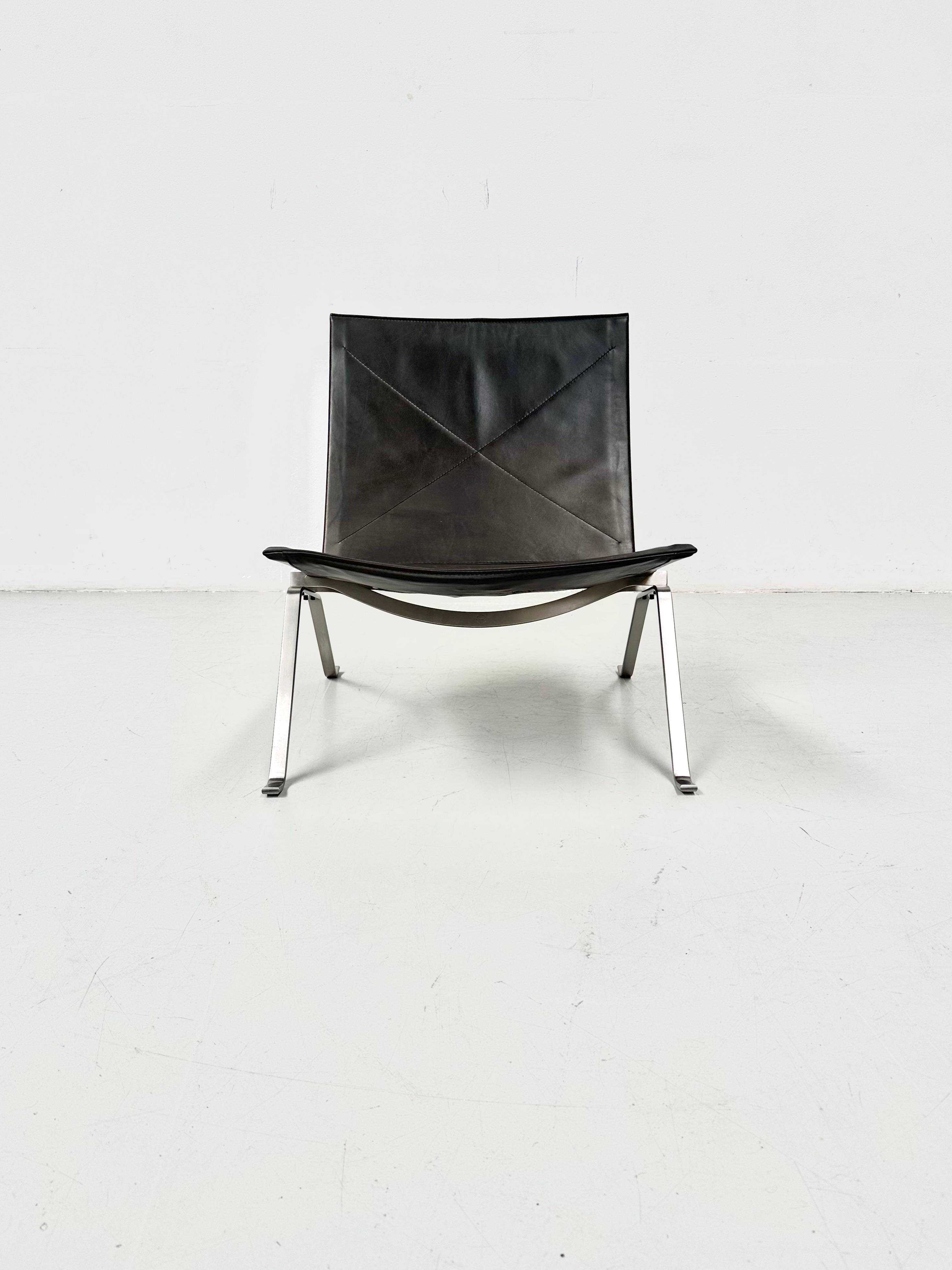 This chair was designed in 1956 by Poul Kjærholm in Denmark. it features a thick black leather seat and backrest and a flatsteel base.

Poul Kjærholm is a trained cabinetmaker who completed his studies at the Danish School of Arts and Crafts, Poul
