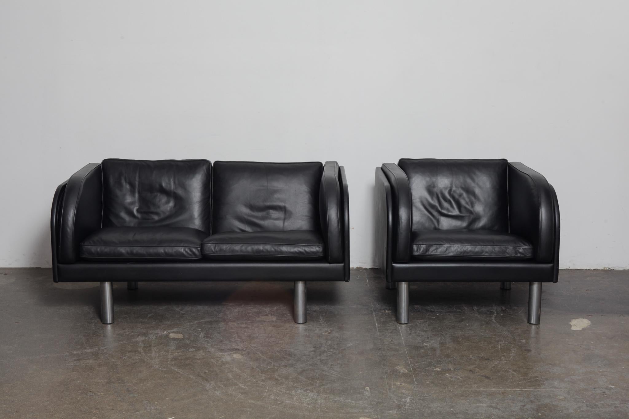 Danish black leather 2-seat sofa and lounge chair set with metal legs, designed by Jørgen Gammelgaard and produced by Erik Jørgensen. Model EJ-20-2. Both are in very good original condition with no leather damage. Rare to get a matching sofa and