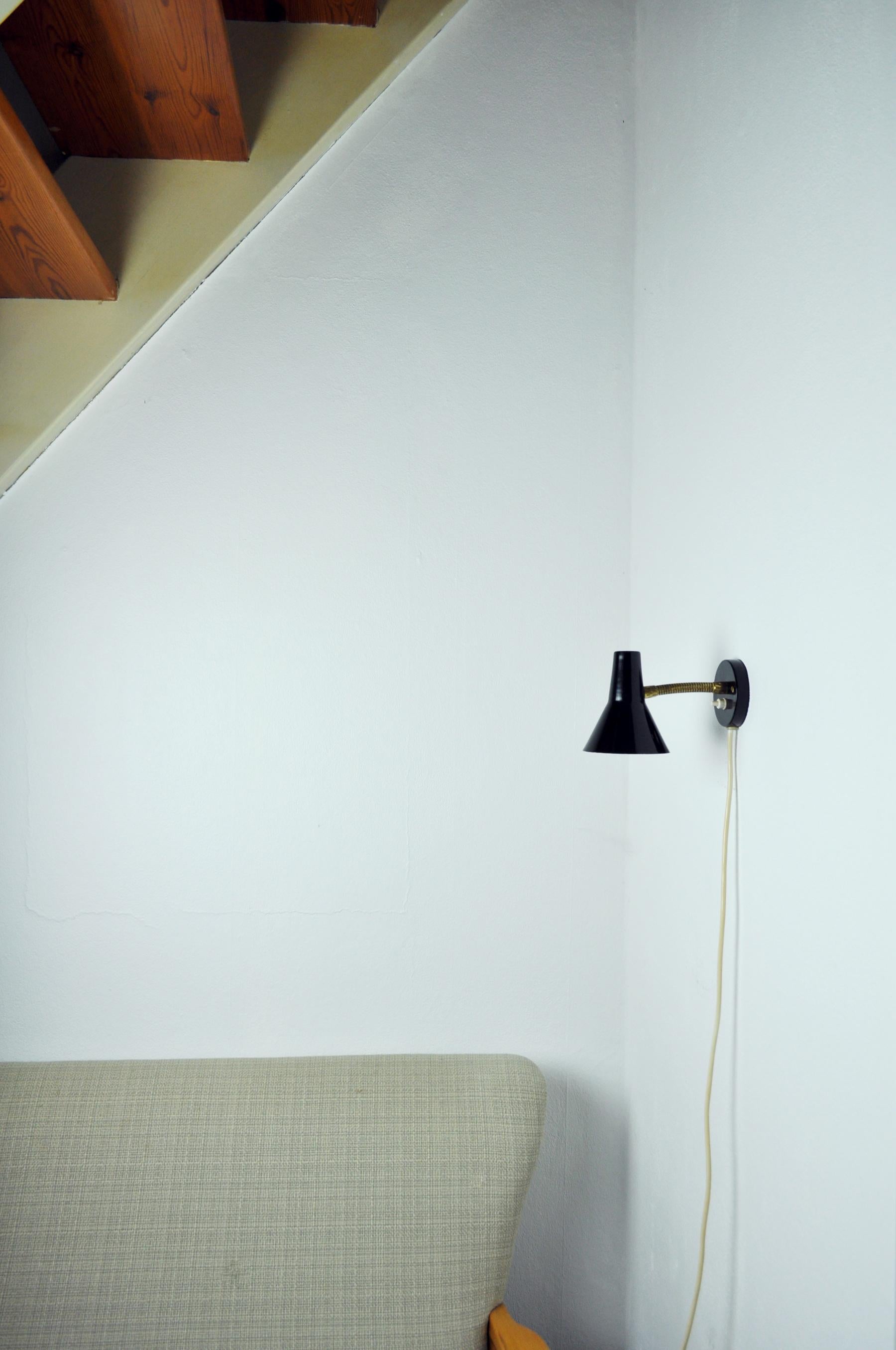 Lacquered Danish Black Wall Lamp with Adjustable Brass Arm For Sale