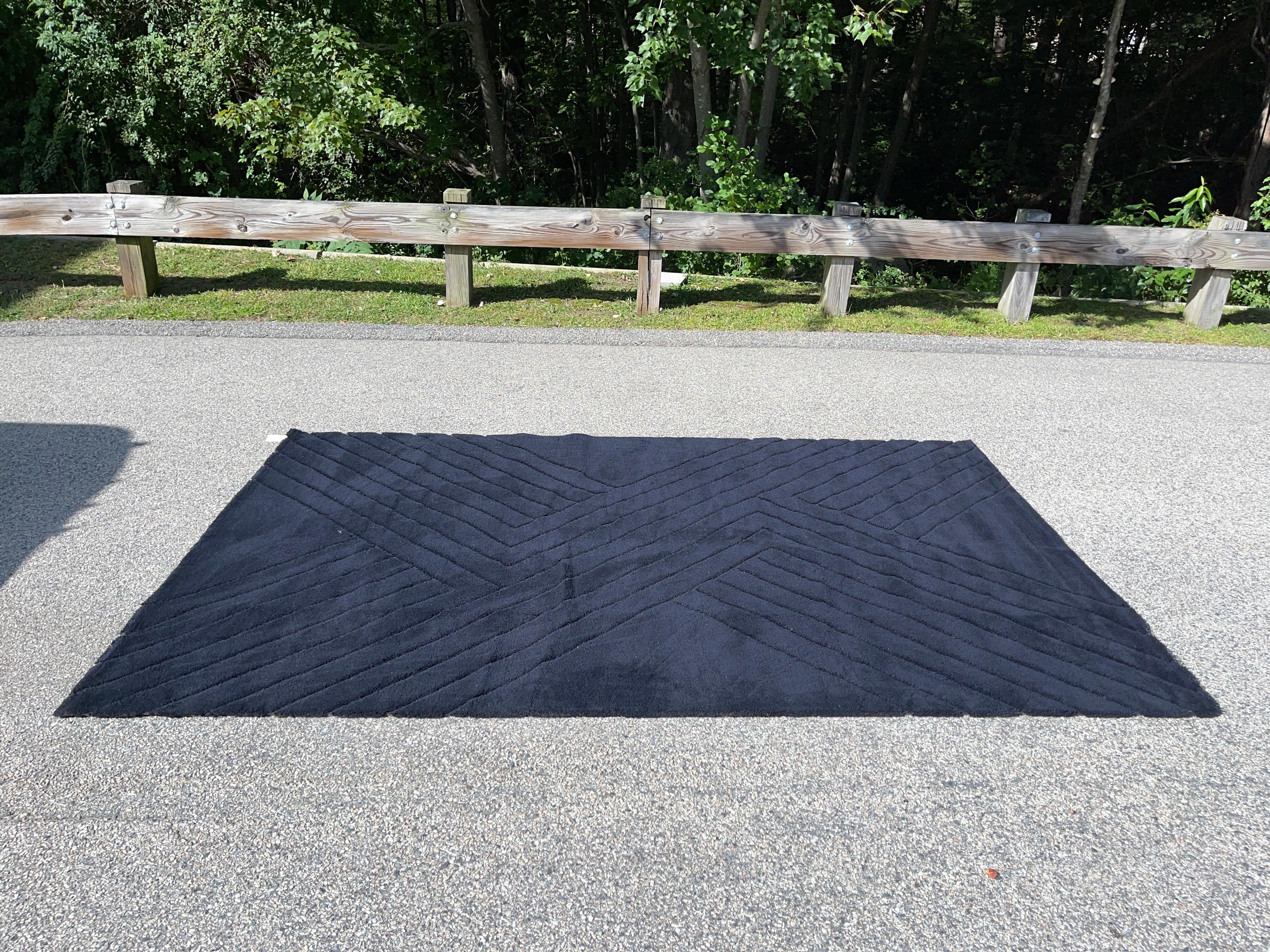 Vintage rectangular 100% black wool sculpted rya rug produced in the 1960's but never used.
Has been kept rolled and wrapped in storage for over 50 years. Your feet will be the very first to walk on it.
Produced in Denmark by Hojer Eksport