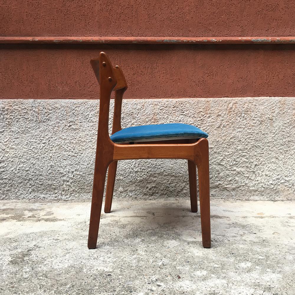 Danish blonde teak chair dating to the sixties, with raised seat, covered in blue velvet and structured in curved solid teak and turned legs.
completely restored
Measures: 52 x 49 x 78 H cm. 
 