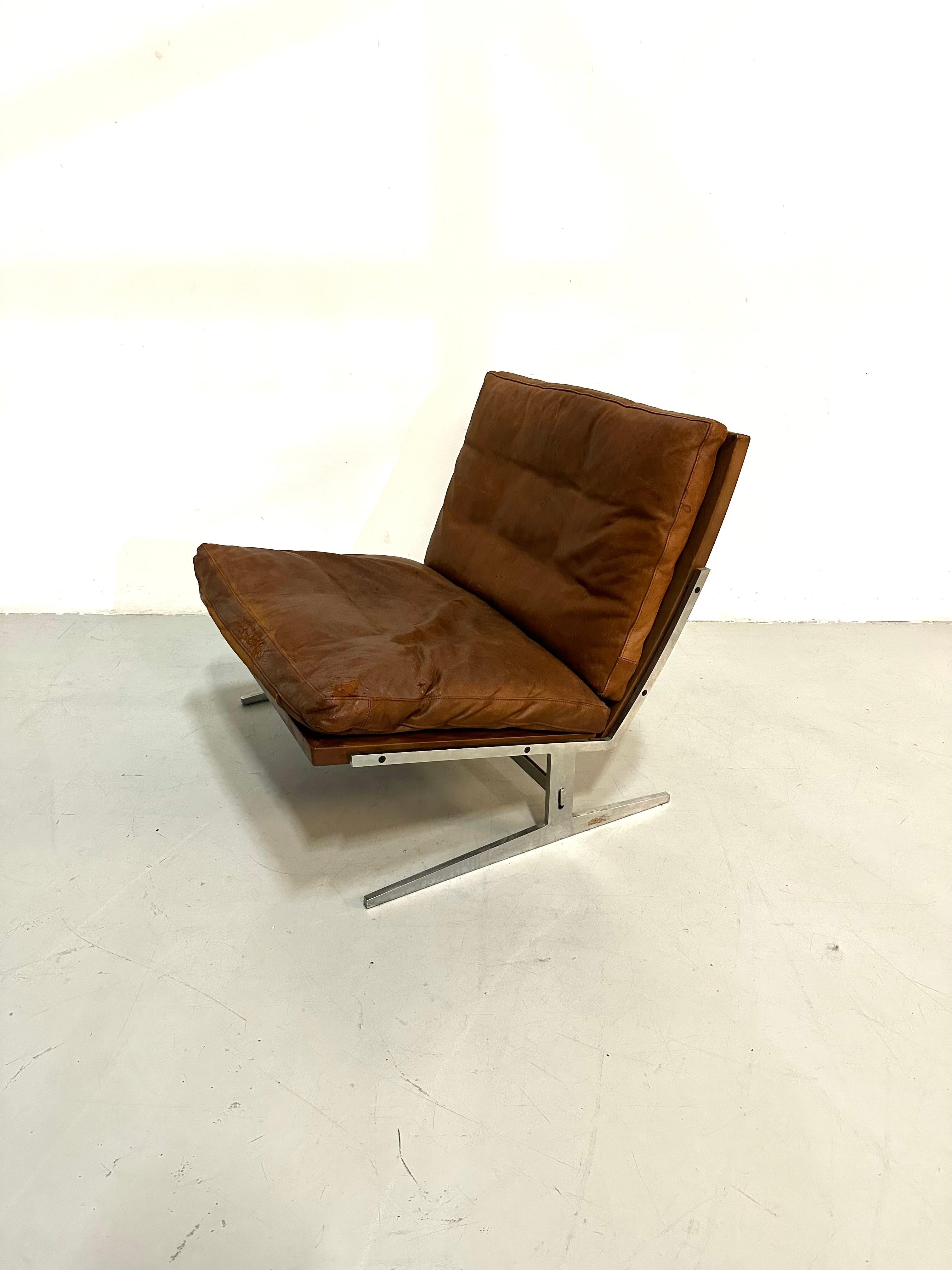 This BO-561 Lounge chair is designed by Preben Juhl Fabricius and Jorgen Kastholm in the sixties. 
The 2 Danish designers met each other in the 50s but start only working together in the 60s. While Fabricius was an educated cabinetmaker , it was