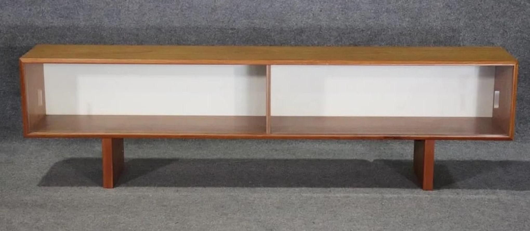 Danish modern credenza topper with sliding doors for book storage use. Designed by Peter Lovig Nielsen.
Please confirm location NY or NJ