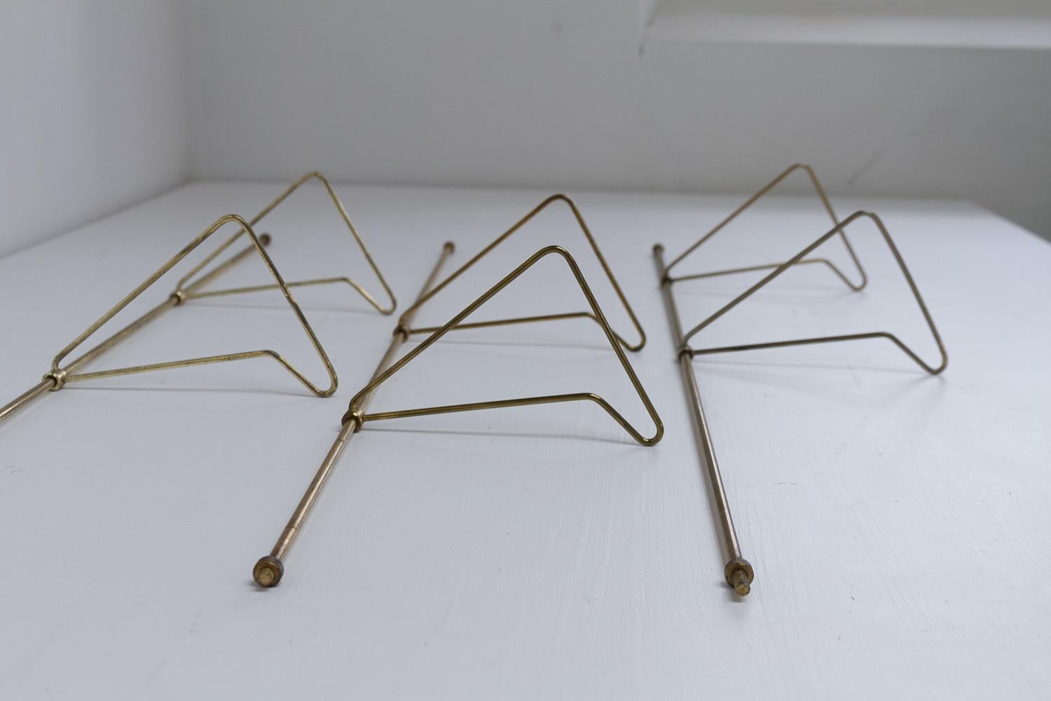 Danish Brass Bookends Royal by Poul Cadovius for Cado, 1960s. Set of 3.

Set of three original double sliding bookends for the Poul Cadovius 