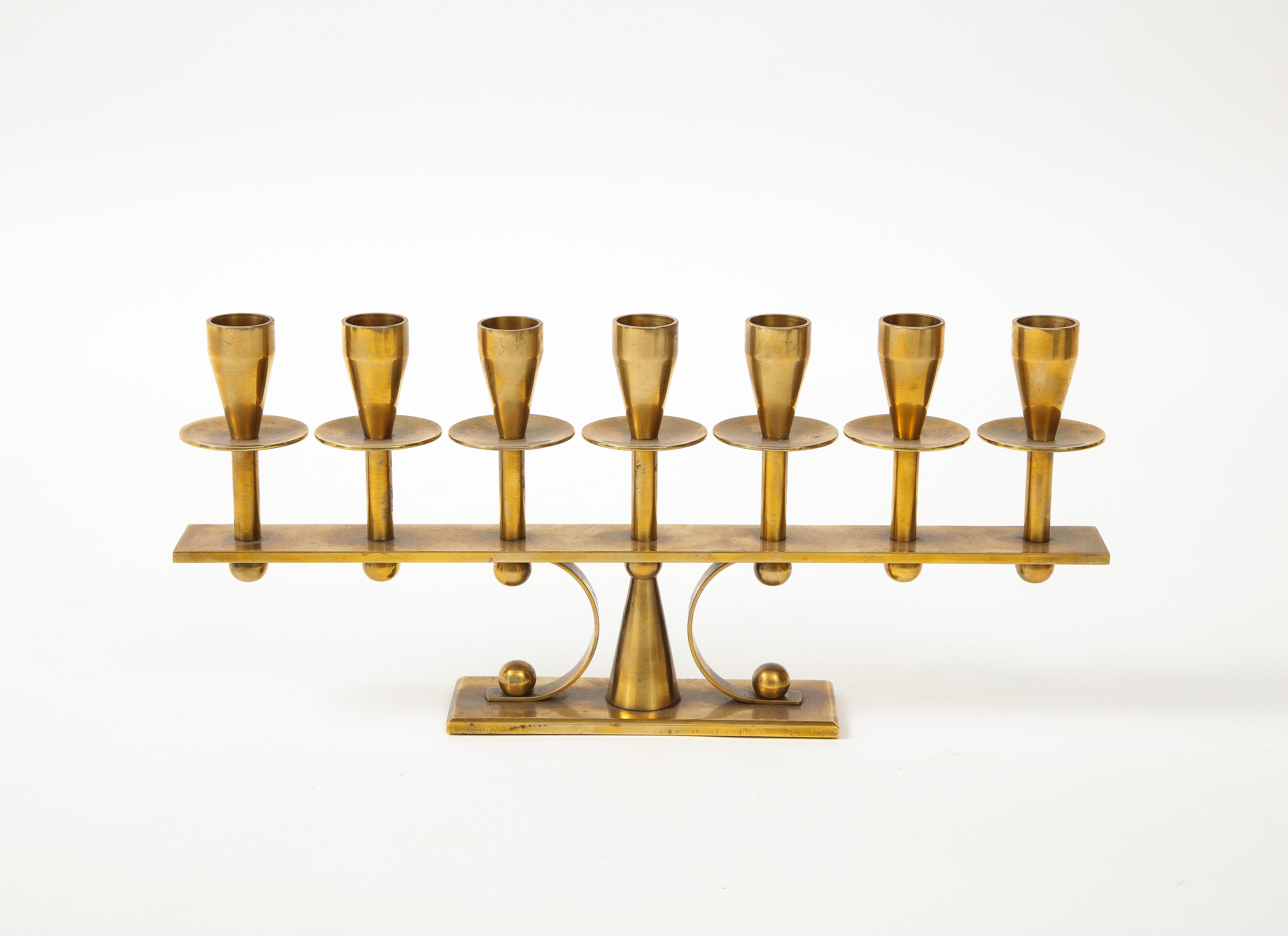 Stunning 1960s solid brass Danish candelabra. It fits two difference size candles.