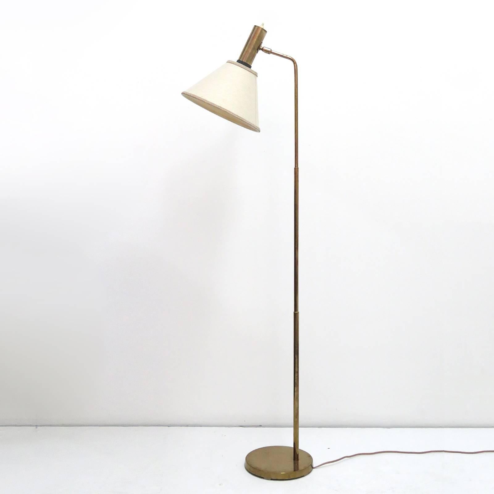 Minimal Danish brass floor lamp by Bergboms with original linen shade, on/off switch on top of the brass cylinder.