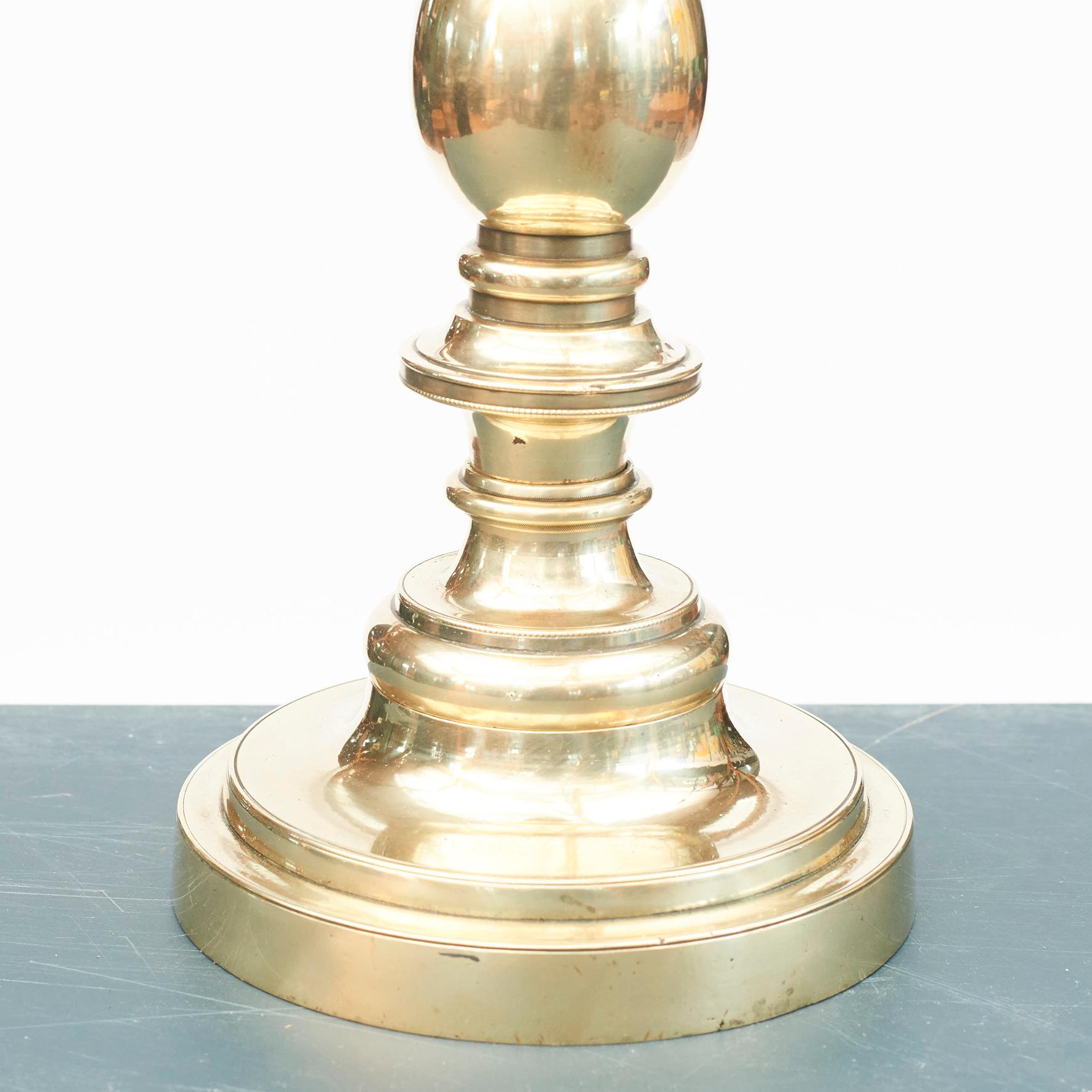 Brass table lamp. Denmark, 1920-1930.
Beautifully designed and crafted. Original top. 
Measures: Sculpture height (to socket) 36 cm, 14.17 in. Total height 62 cm, 24.41 in.

Lamp shade not included.
