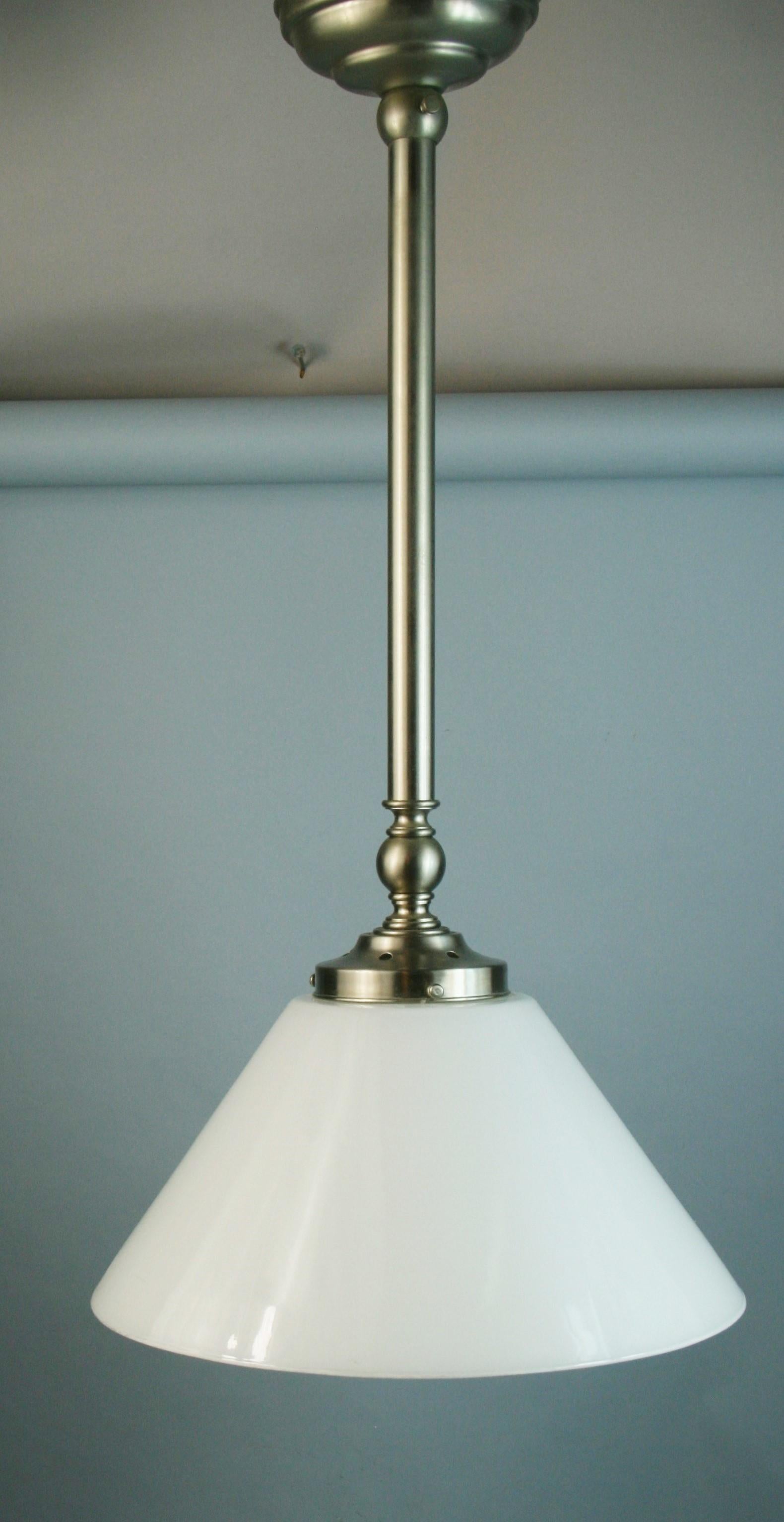 1547 Danish brushed nickel milk glass cone pendant with removable glass bottom
Rewired takes 2 Edison based bulbs 60 watt max
2 pendants available priced individually