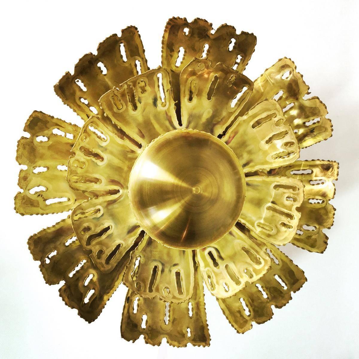 This beautiful wall light was designed by Sven Aage Holm Sørensen for Holm Sørensen and Co. in the 1960s.

It is made from acid-etched brass. Brass in a flower form. This lamp is in a very good vintage condition with some very few age signs of