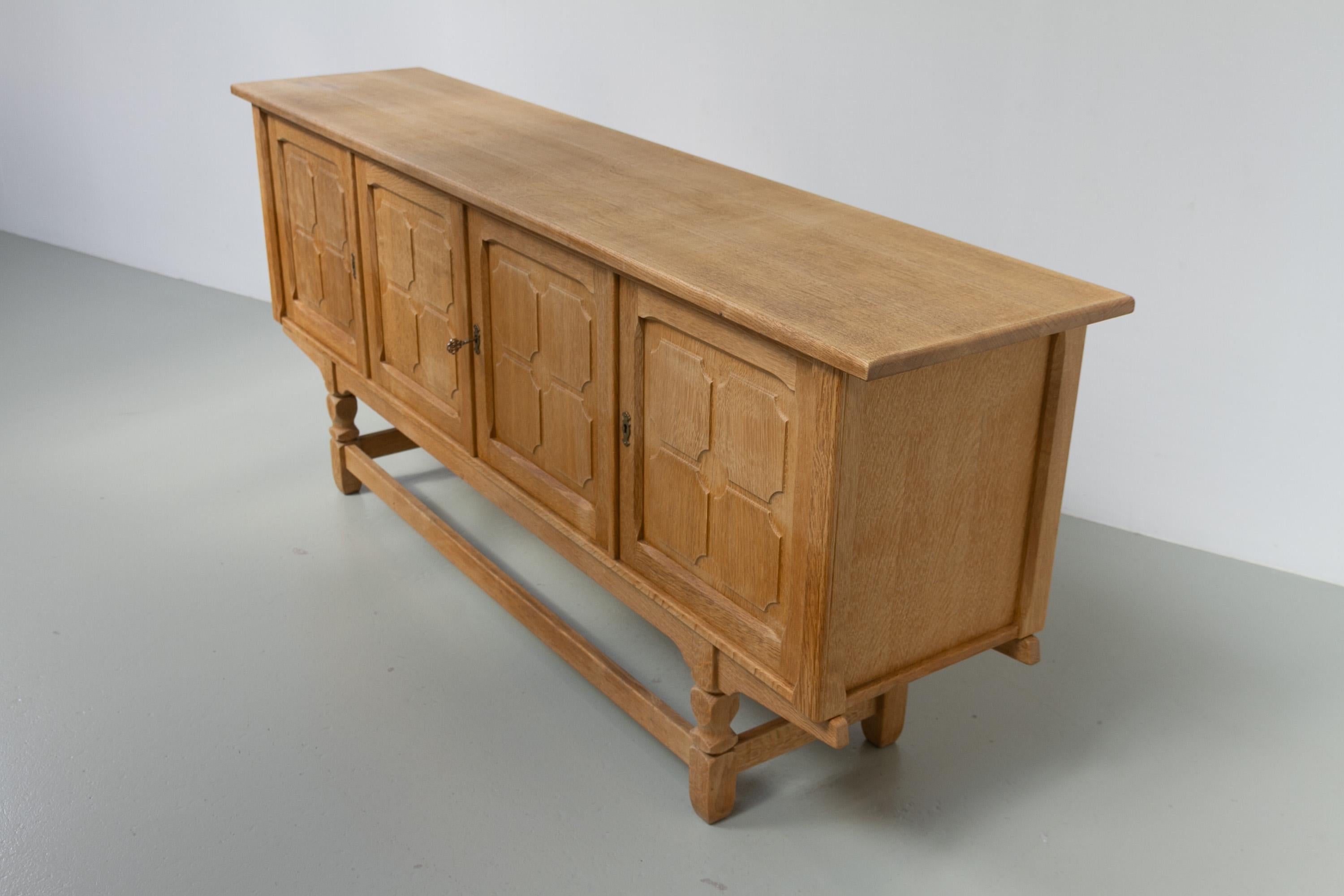 Mid-20th Century Danish Brutalist Low Oak Sideboard attributed to Henning Kjærnulf, 1960s. For Sale