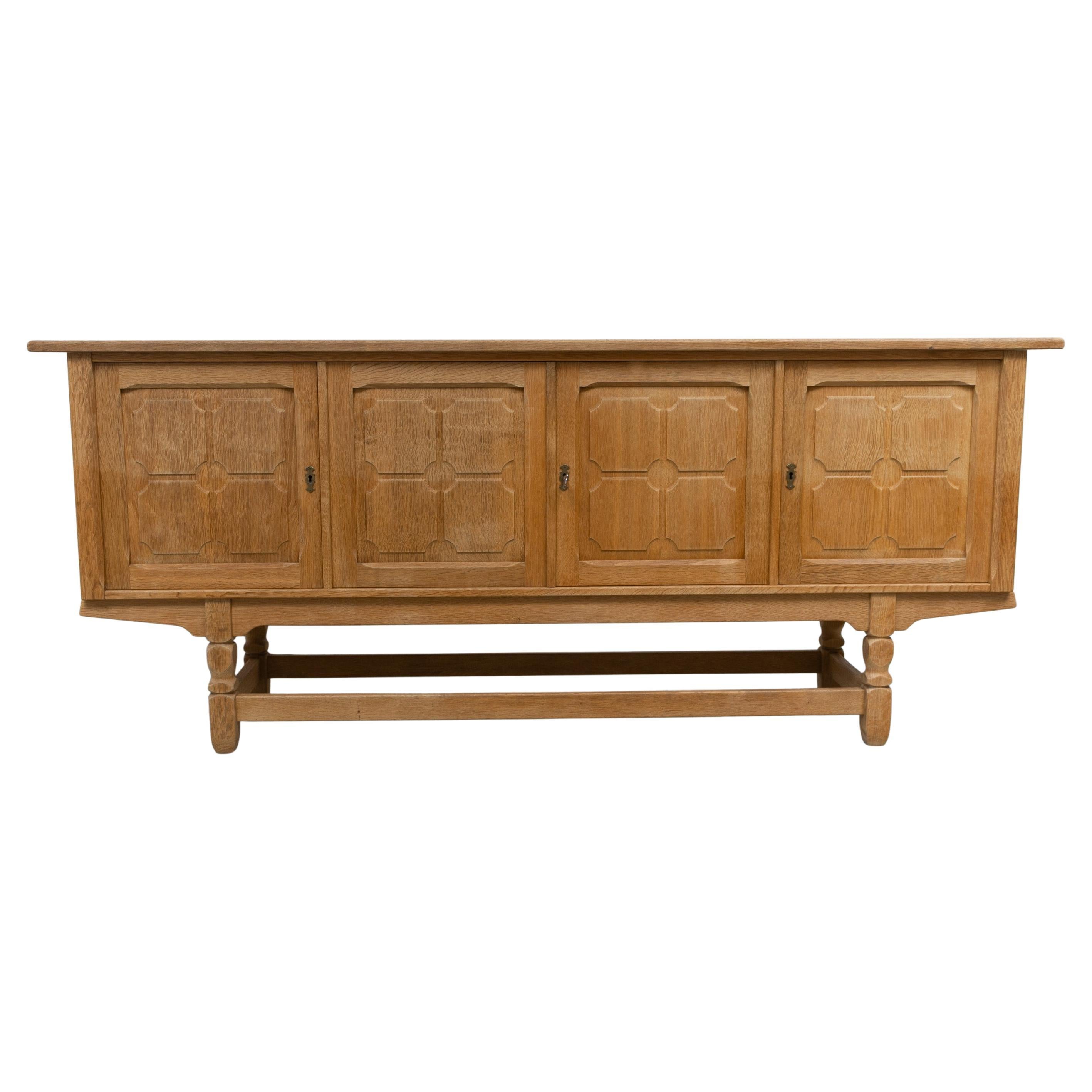 Danish Brutalist Low Oak Sideboard attributed to Henning Kjærnulf, 1960s. For Sale