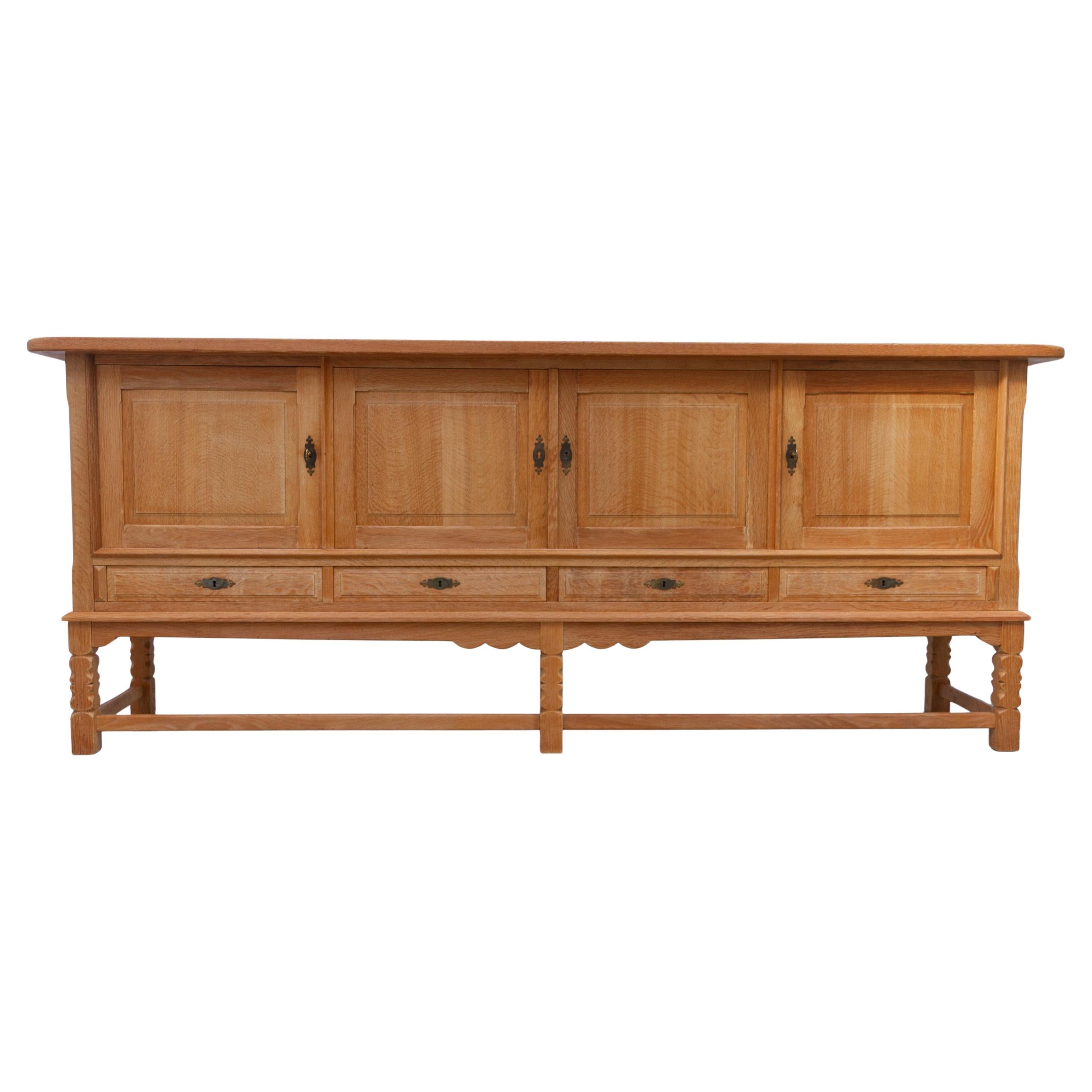Danish Brutalist Low Oak Sideboard attributed to Henning Kjærnulf, 1960s. For Sale