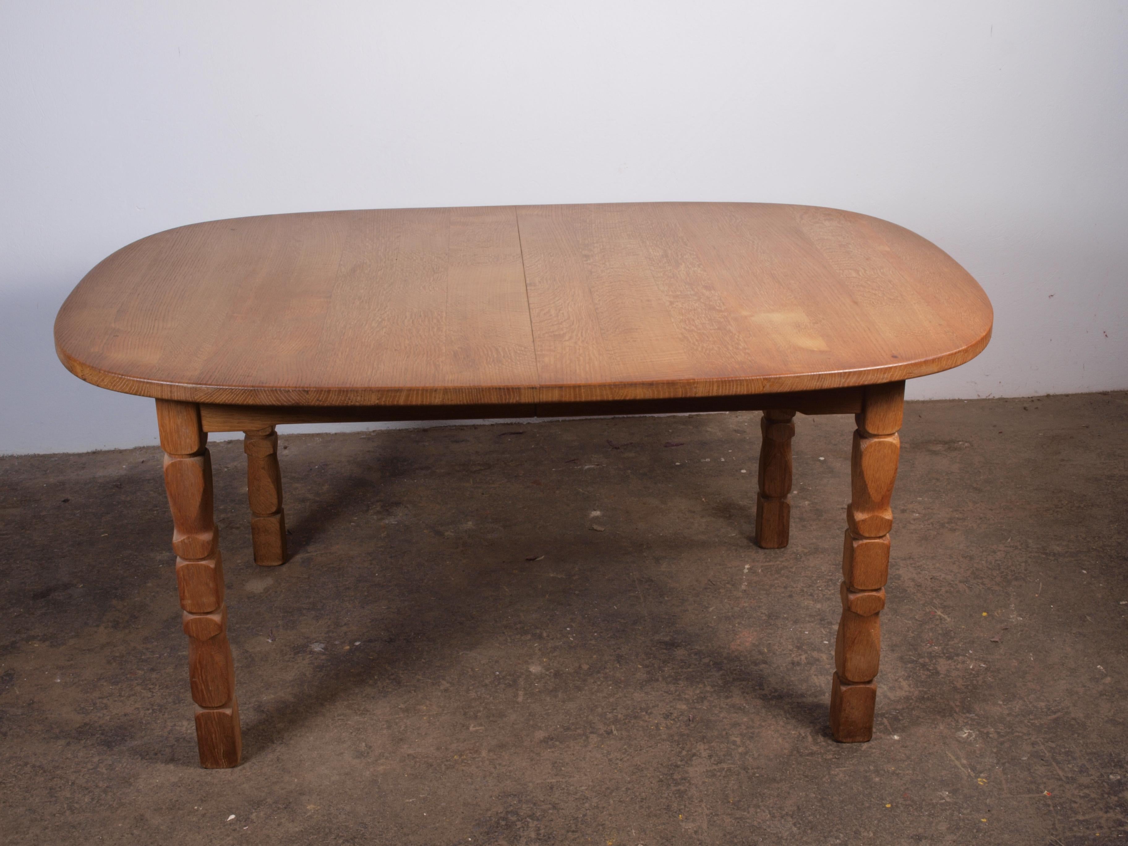Vintage Design

This vintage oak table shares the essence of Kjaernulf's furniture design. Its brutalist aesthetic, highlighted by intricate leg carvings, is beautifully balanced by its rounded shape. In excellent vintage condition and gliding