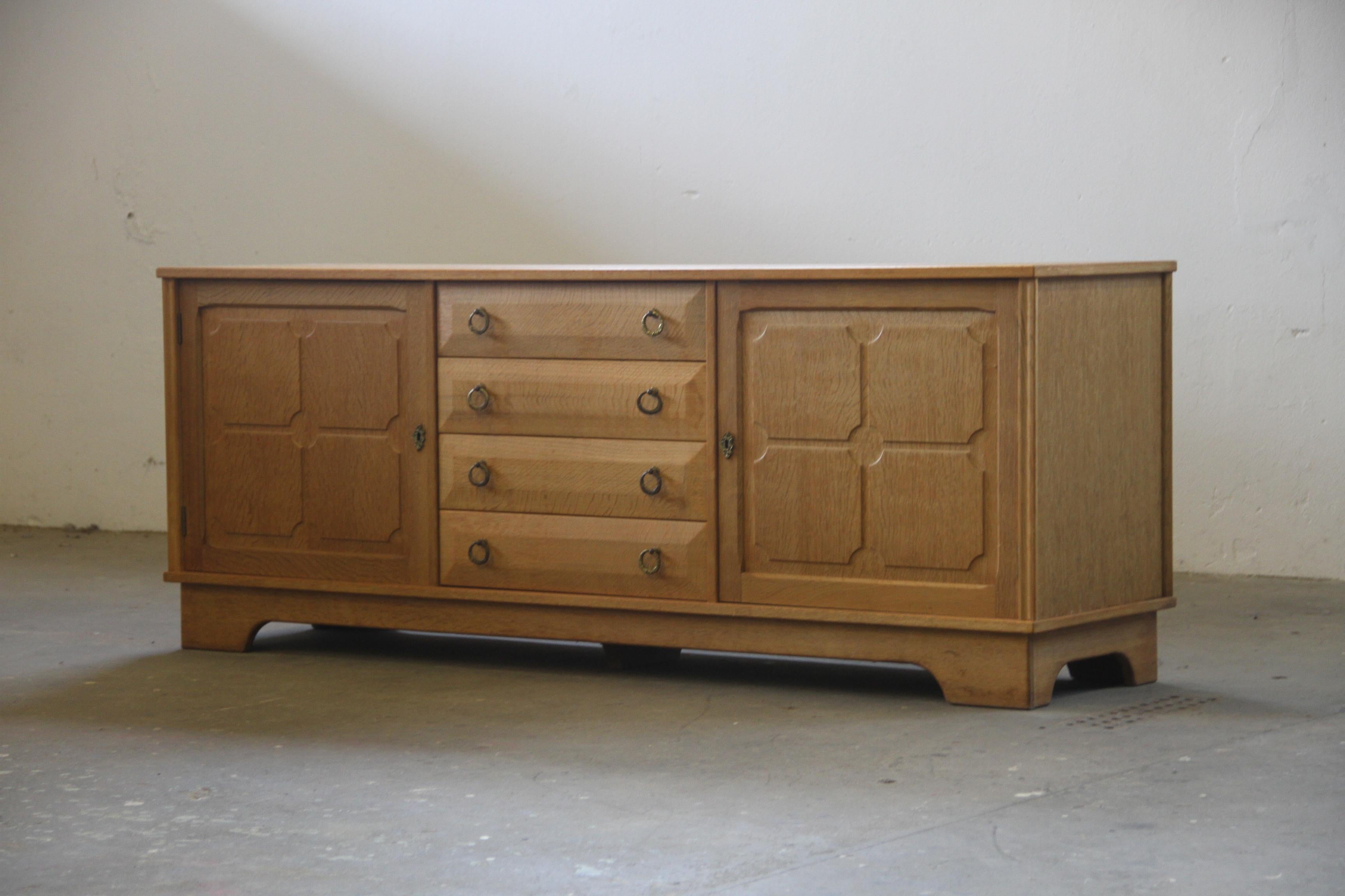 Late 20th Century Danish Brutalist Oak Low Sideboard, credenza style of Henning Kjærnulf, 1970s For Sale