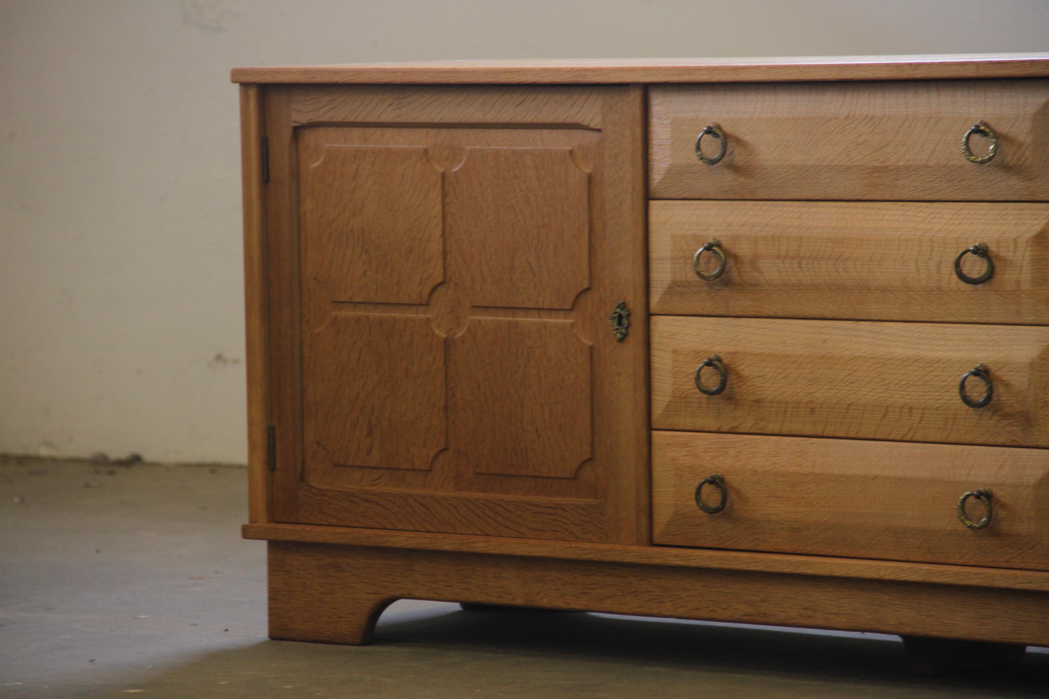Danish Brutalist Oak Low Sideboard, credenza style of Henning Kjærnulf, 1970s For Sale 1