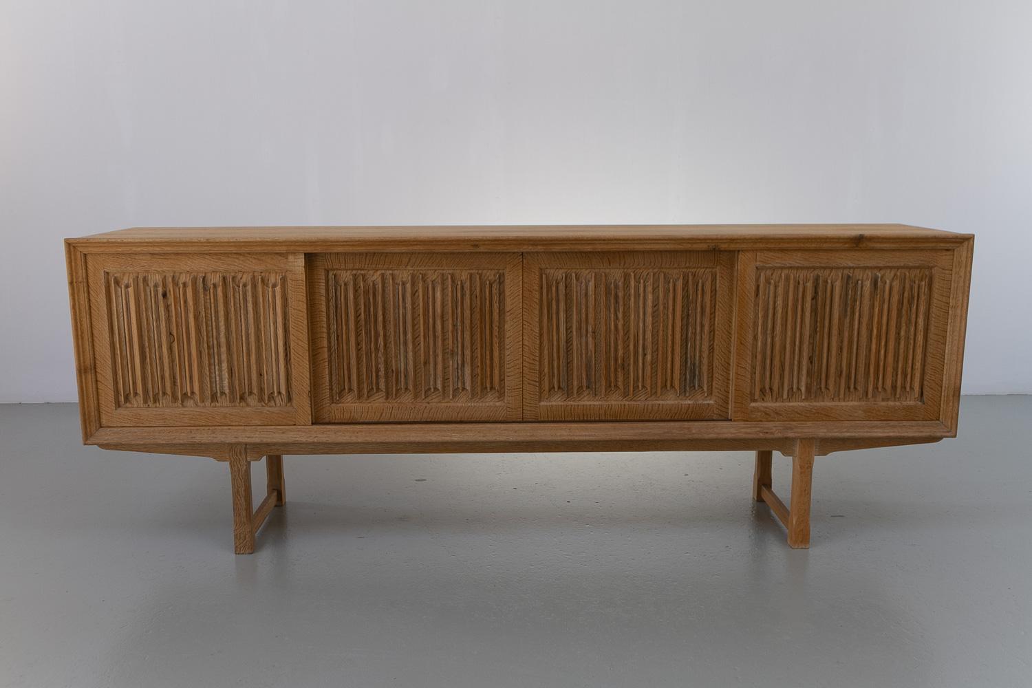 Mid-20th Century Danish Brutalist Oak Sideboard by Henning Kjærnulf for Nyrup Møbelfabrik, 1960s. For Sale