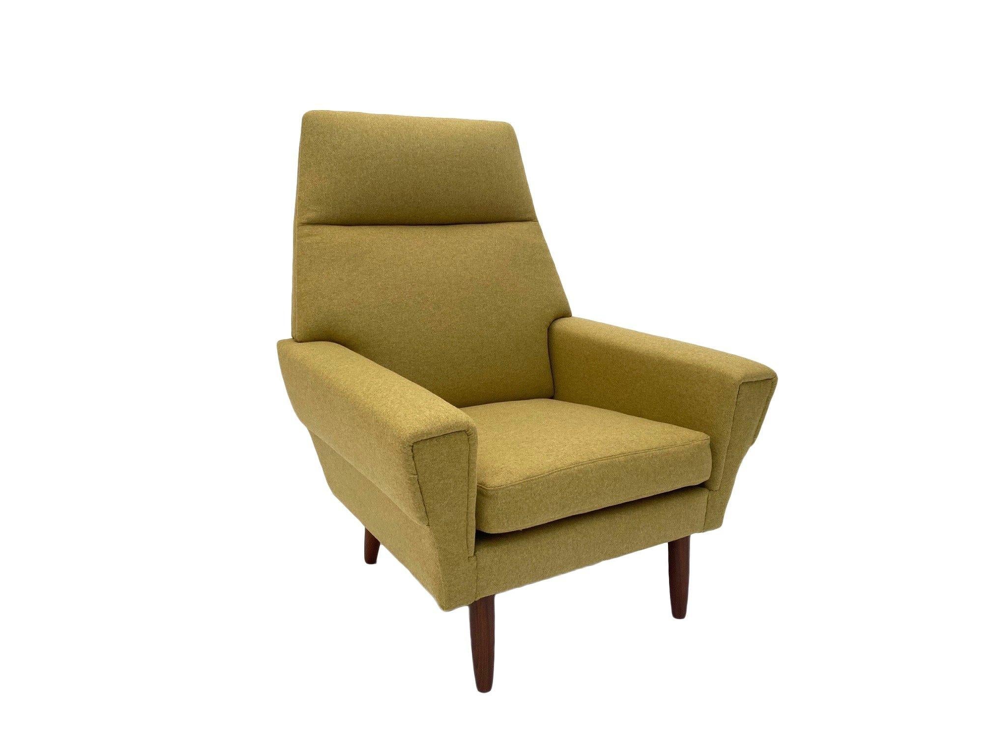 A beautiful Danish buttermilk wool and teak highback armchair, this would make a stylish addition to any living or work area.

The chair has a wide seat and padded backrest for enhanced comfort. A striking piece of classic Scandinavian