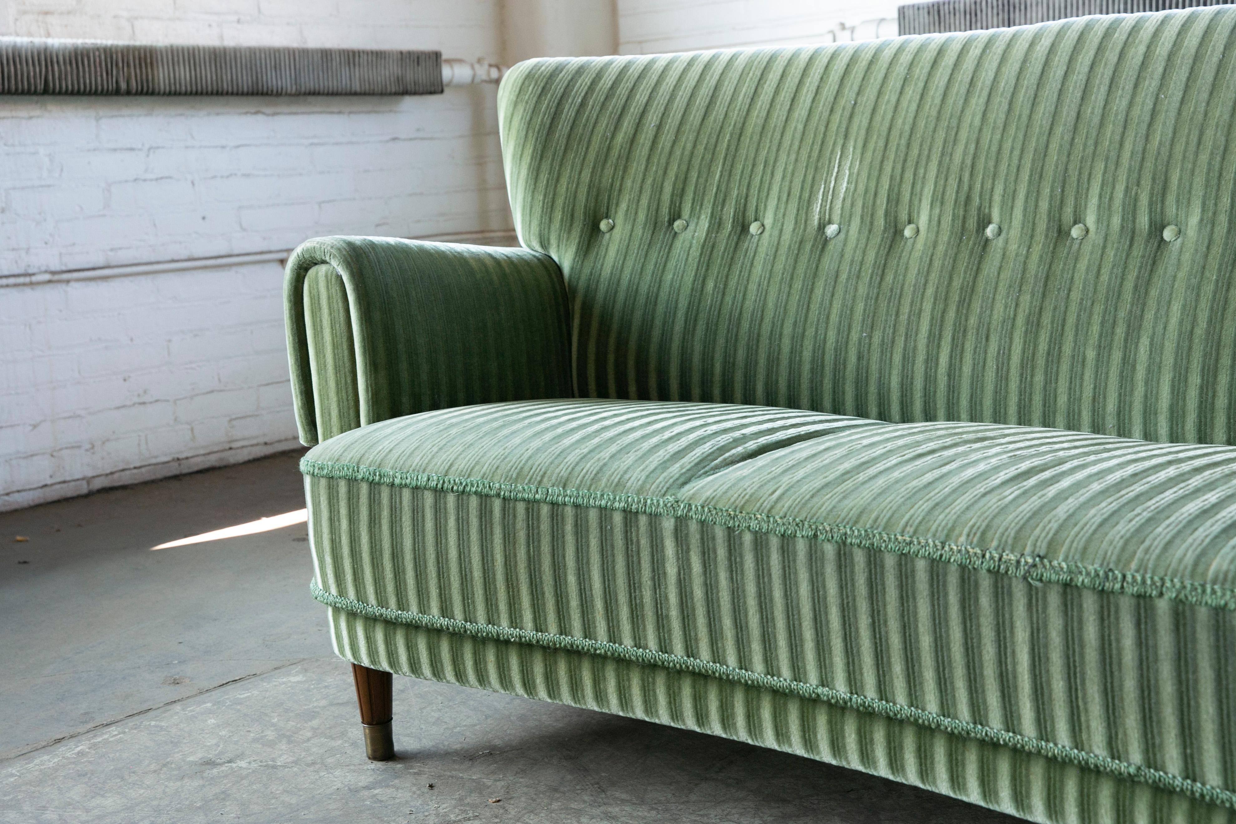 Mid-20th Century Danish Ca. 1950 Curved Sofa in Green Mohair and Brass Capped Legs