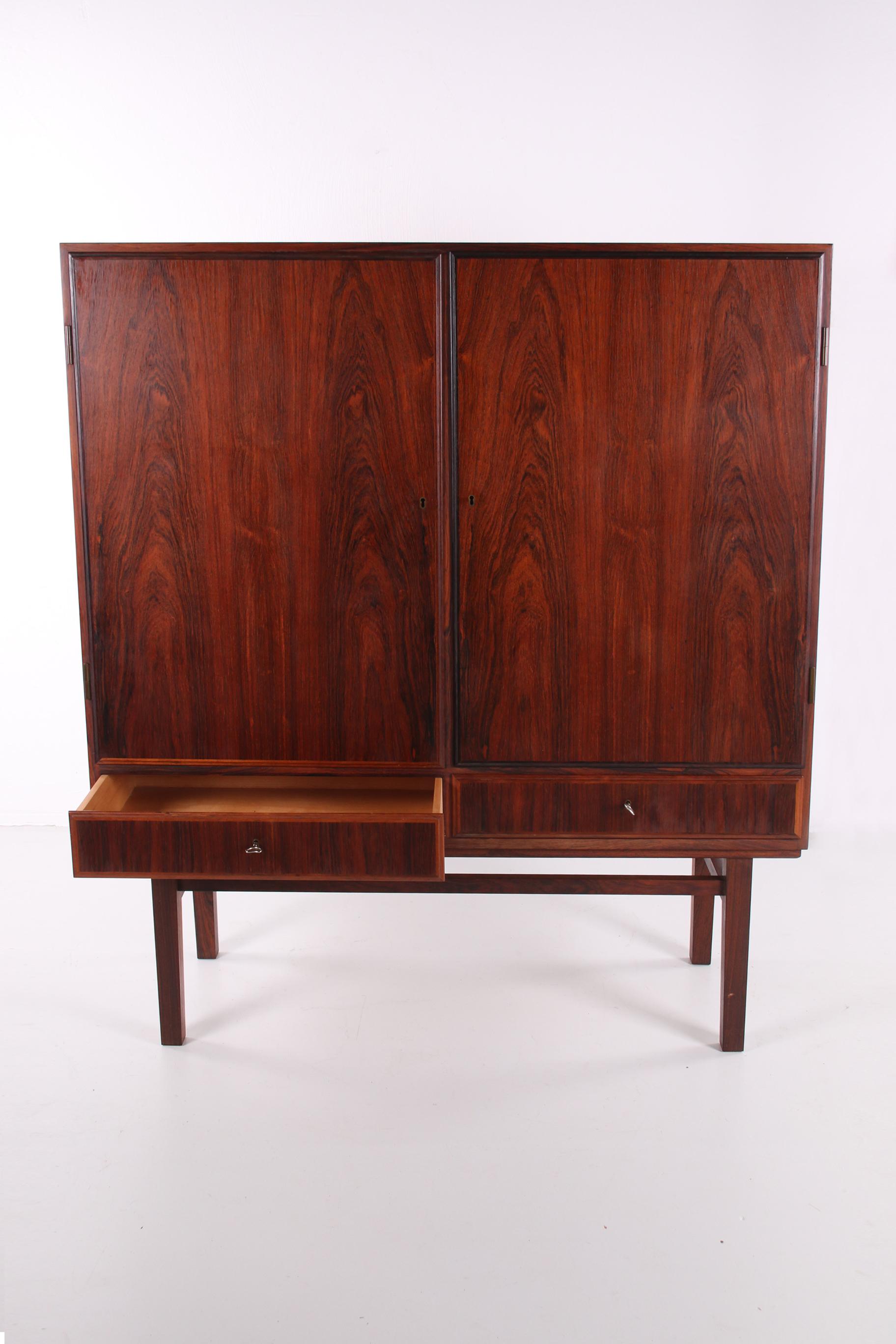 Danish cabinet high model by Gunni Omann made by Omann Jun,1960s

A stylish cabinet, this darkwood model by Gunni Omann for the Oman Jun. Mobelfabrik. The superior level of quality and the use of high-quality materials on top of the design make it a