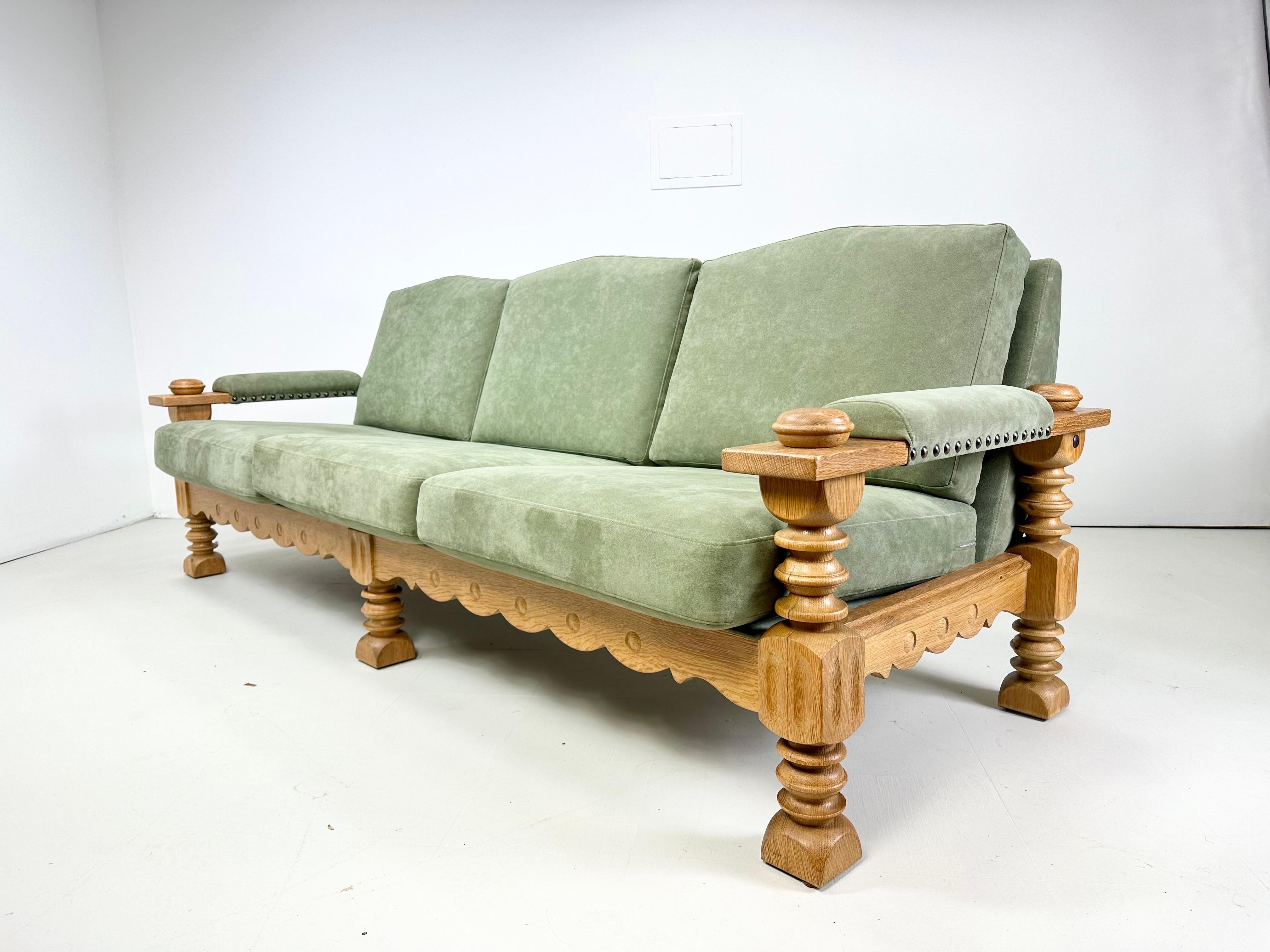 Danish Cabinet maker sofa. Carved oak frame. Nail head details. More recent micro suede upholstery. 1970’s, Denmark

Delivery to NYC Area $550. Please inquire.