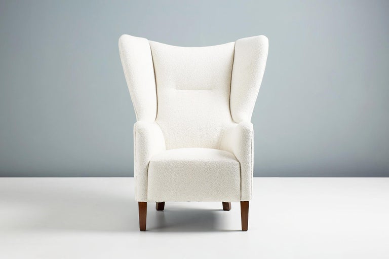 Danish cabinetmaker - wing chair c1940s.

Angular wing chair by an anonymous Danish cabinetmaker dating from the 1940s. The chair has stained beech legs and has been reupholstered in off-white boucle fabric.


