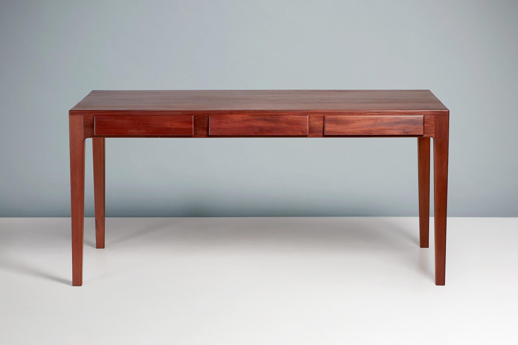 Danish cabinetmaker - 1940s writing desk

This exceptional, minimalist desk was produced in Denmark in the 1940s by an anonymous cabinetmaker and we believe it to be unique. The desk is made from exquisite Cuban mahogany with beautiful pippy grain