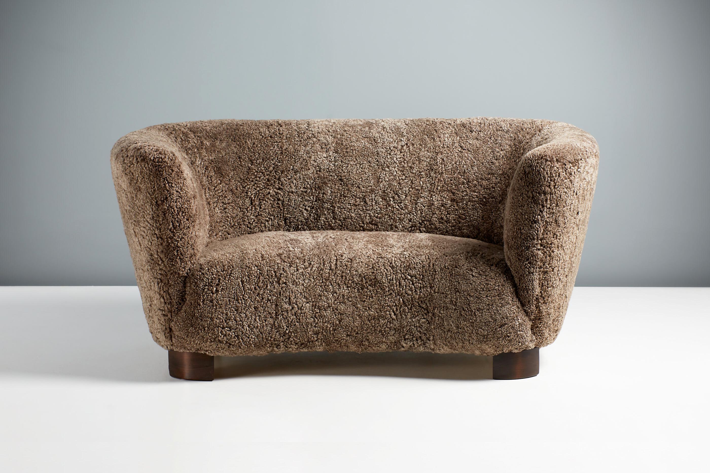 Danish Cabinetmaker Love Seat Sofa, c1950s

Love seat sofa designed and made in Denmark in the 1940s. This example has been reupholstered in luxurious Australian brown sheepskin from Skandilock, Sweden at our workshops in London. The legs are